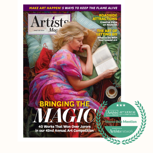 A woman with blonde hair lying on a couch, reading a book, with a colorful blanket over her. A cup of coffee and some art supplies are nearby. The cover features magazine titles and headlines about art.
