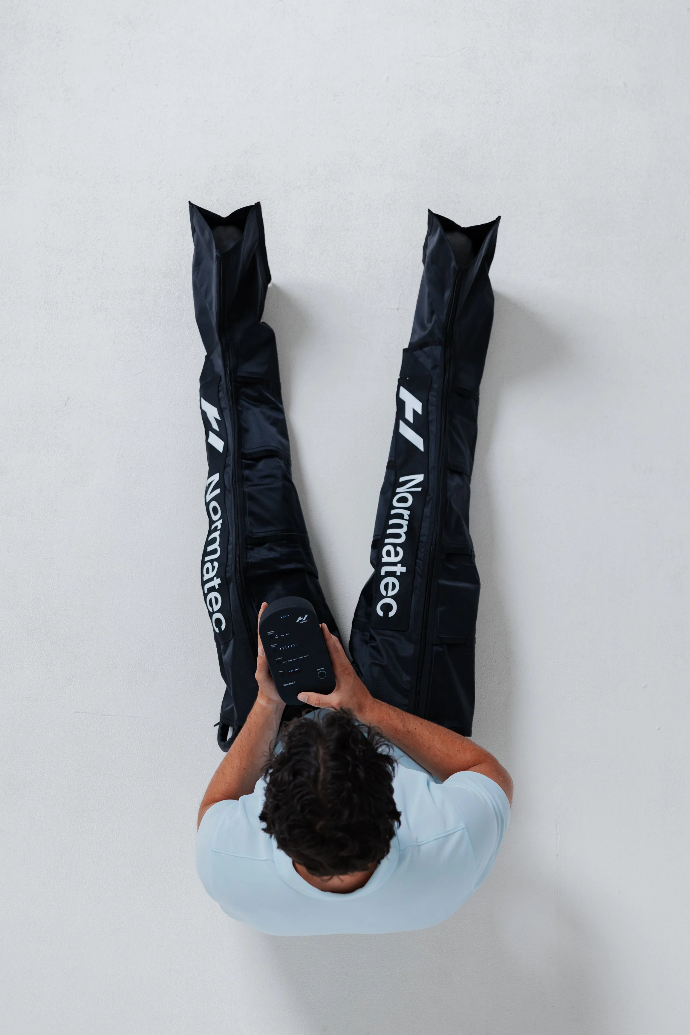 Normatec compression boots therapy for leg muscle recovery at The Recover Factory Amsterdam.