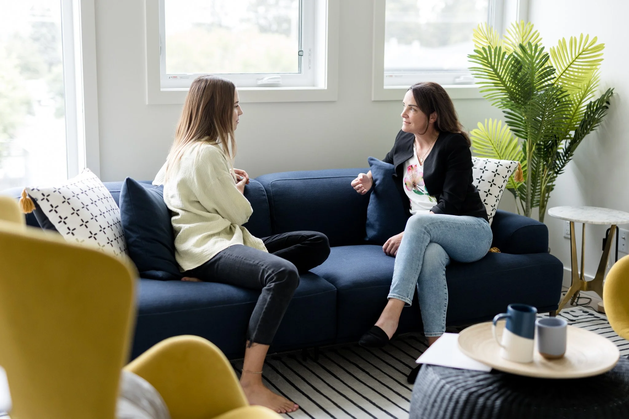 Psychologist providing therapy in Calgary during an in-person counselling session at NU Psychology.