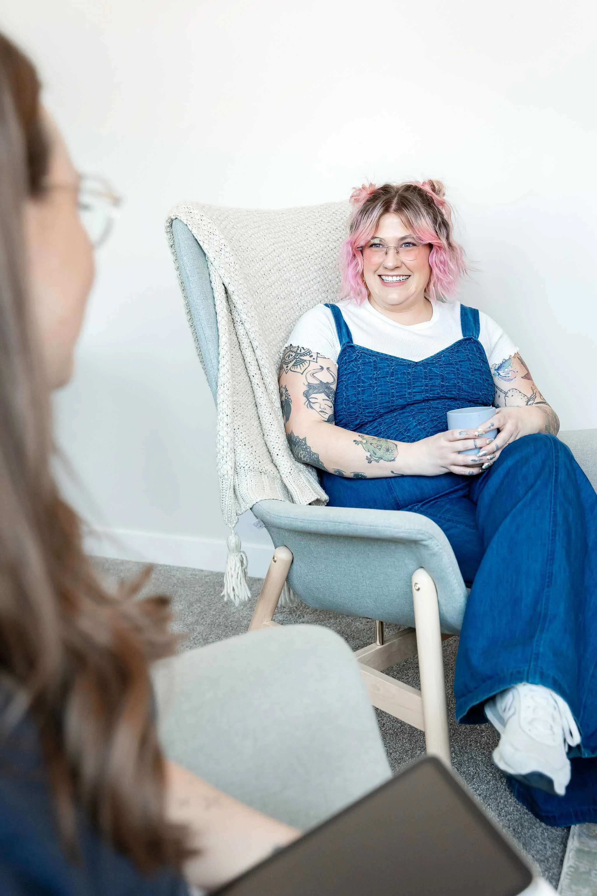Couple talking together during a couples therapy session with a psychologist in Calgary focused on communication, connection, trust, and relationship growth