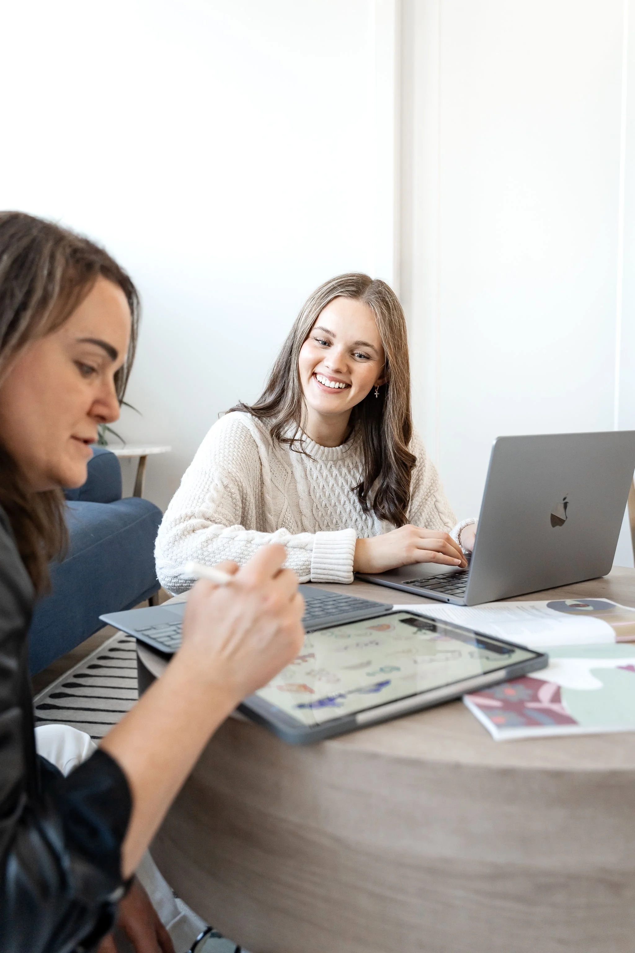 Person smiling during a supportive therapy conversation about managing overwhelm and emotional load.