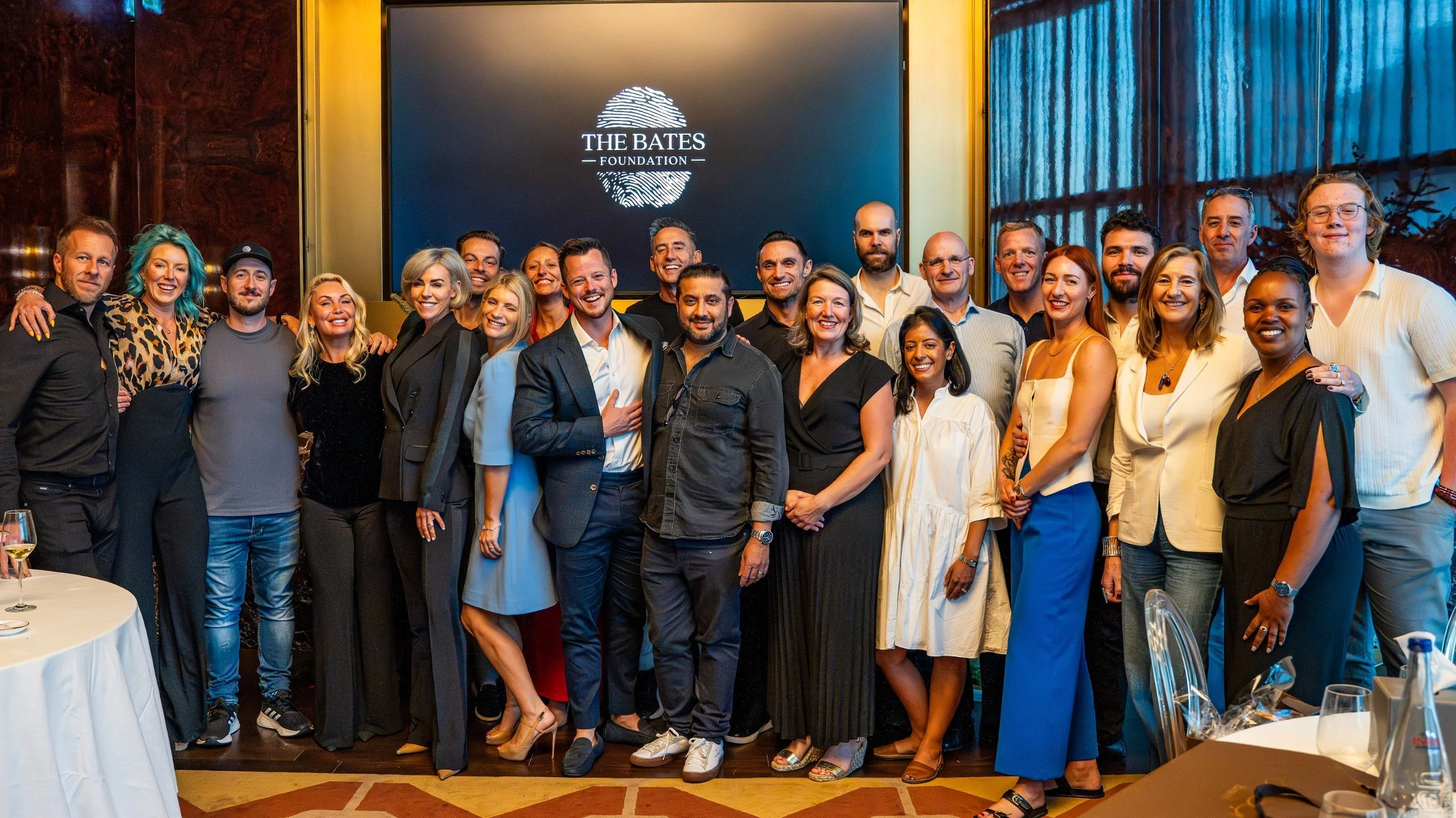 Bates Foundation Patrons standing together wearing smart business clothes