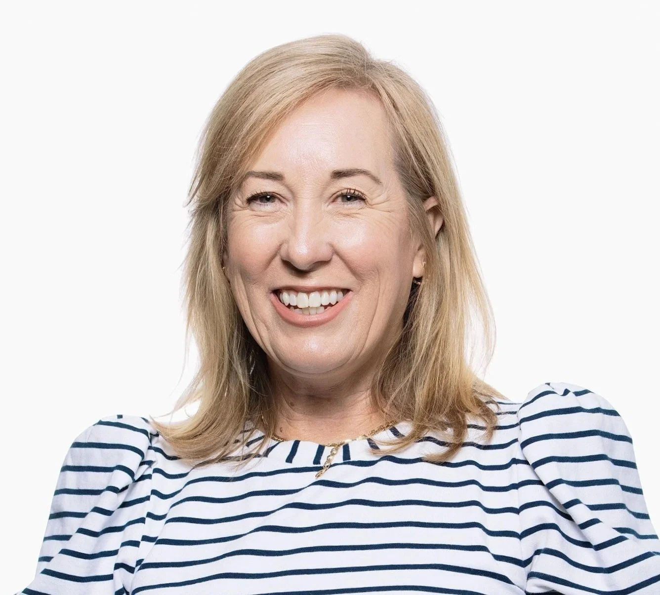 Smiling woman in blue and white striped shirt.