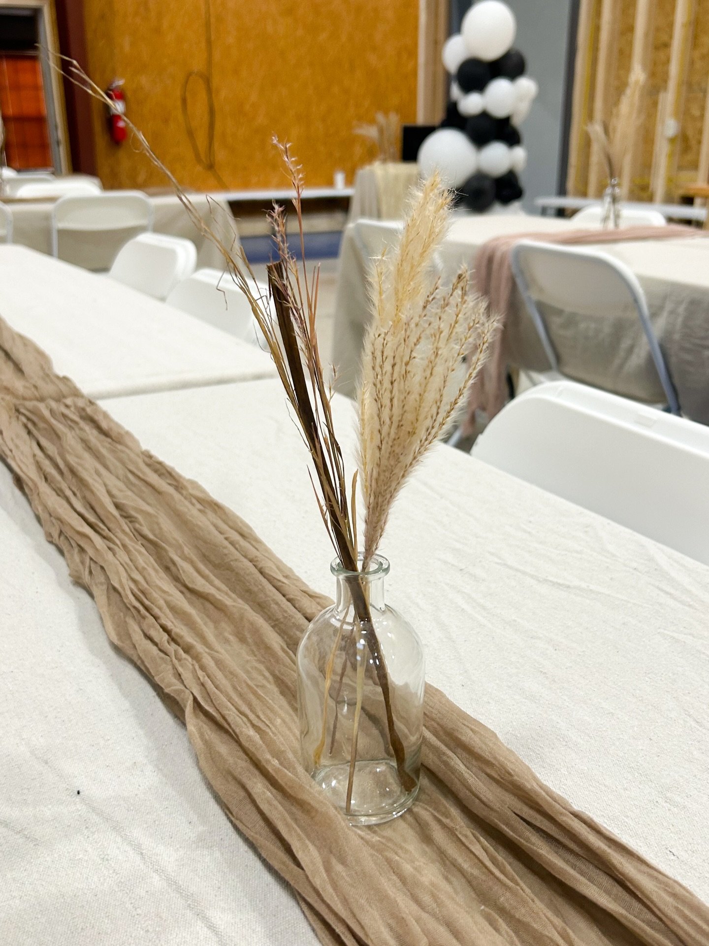 February 28 - March 2, 2025: To dress up each table, we used our favorite canvas tablecloths and layered in a beige cheesecloth runner to create some texture. Each table was finished with a petite dried floral arrangement. #MFDSevents #BNBtower