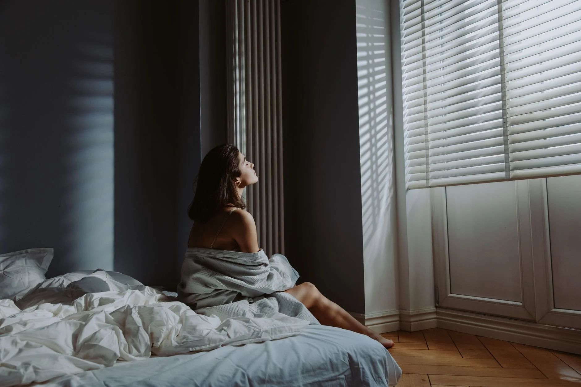 A calm, grounded look at why low moods can show up without an obvious reason, and when talking to a therapist may help.