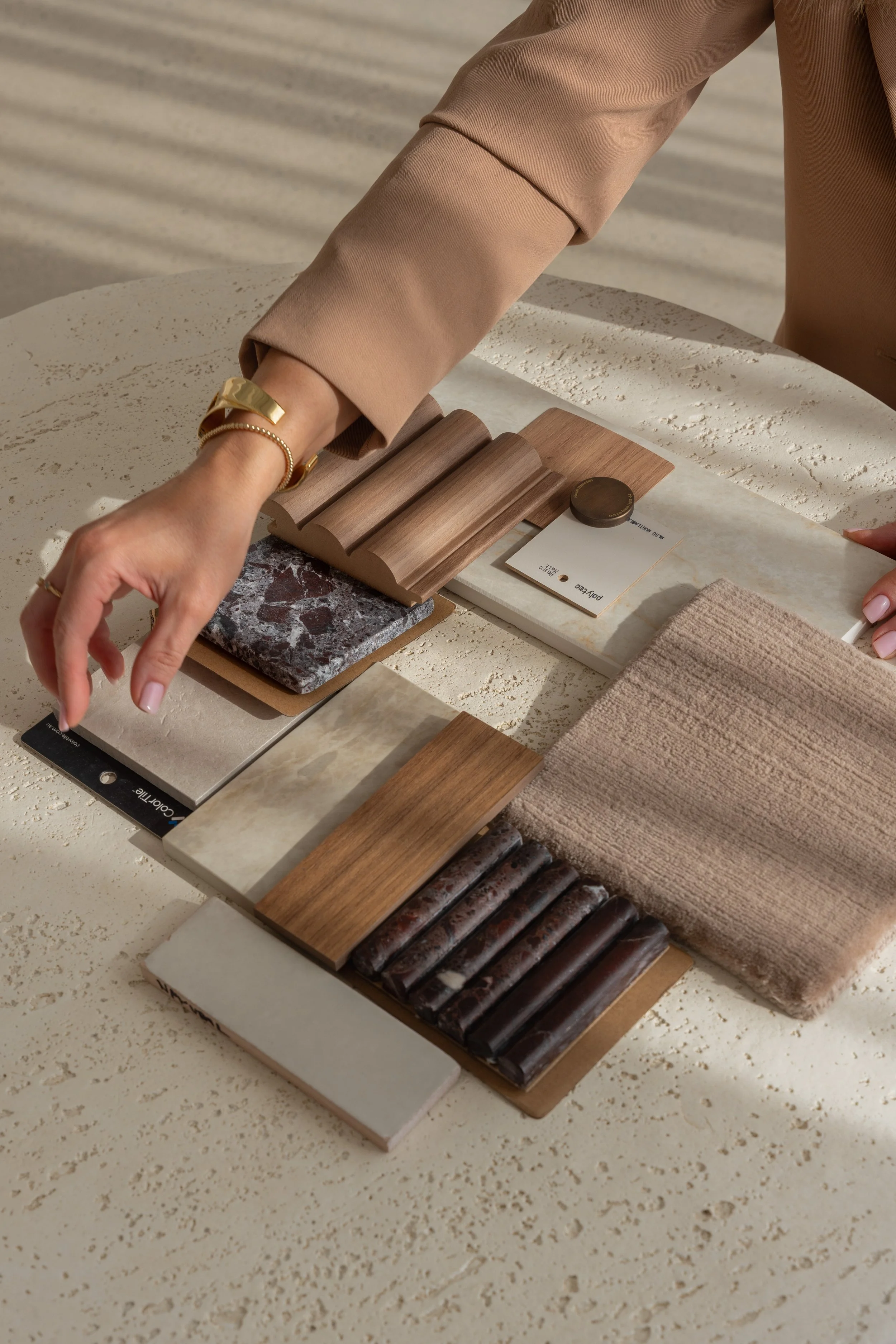 Signature eDesign material palette — timber veneers, natural stone, and finish swatches curated remotely by Lúrae Studio for clients across Australia