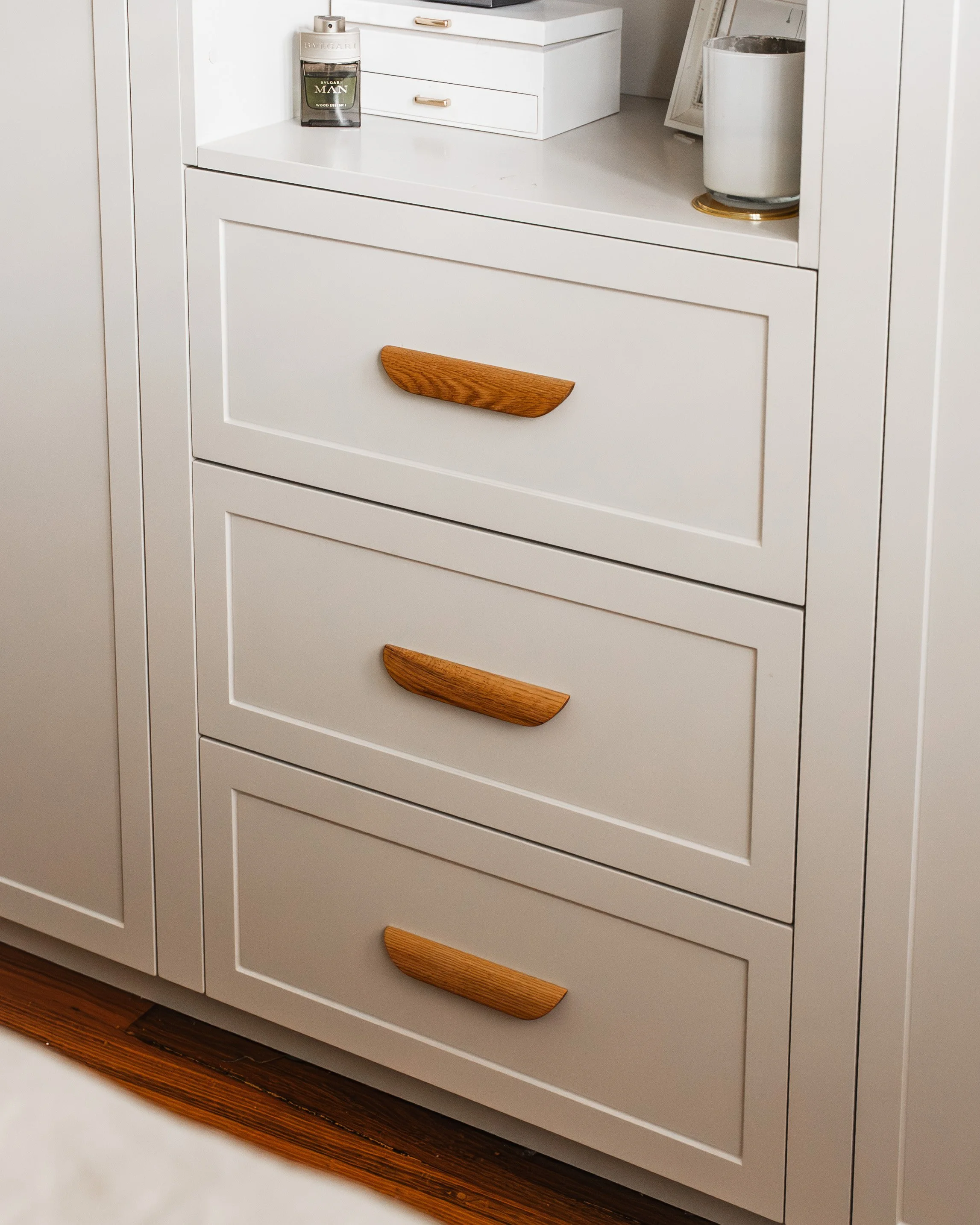Streamlined three-door wardrobe with timber pull handles, main bedroom, Yarraville renovation by Lúrae Studio