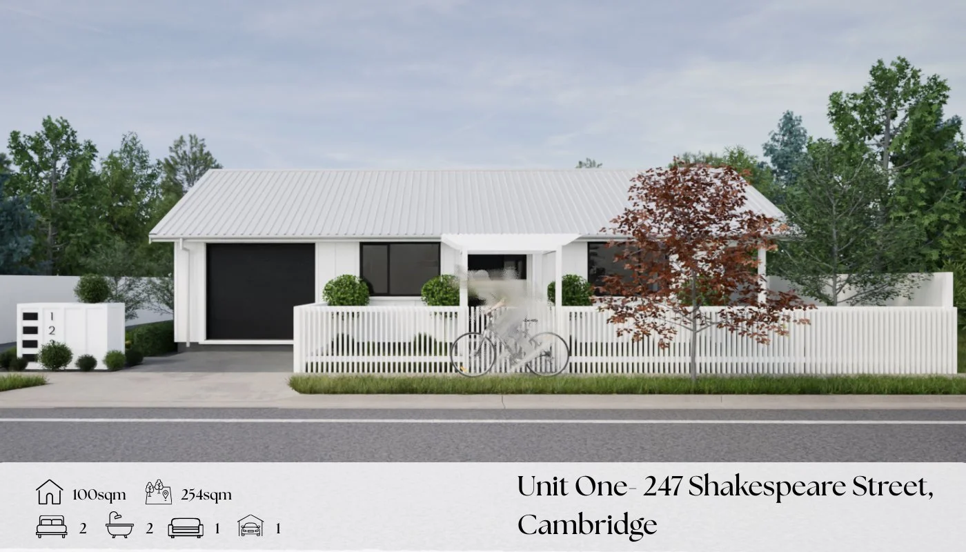 A modern house with white exterior, black garage door, and white picket fence on a street. There are trees, shrubs, a bicycle, and a house number display in front.