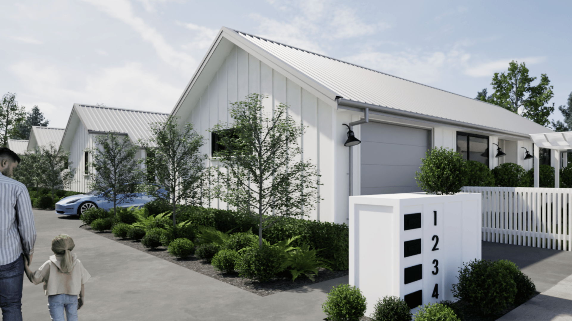 Modern white residential row houses with gable roofs, surrounded by greenery and a sidewalk where an adult man and a young girl are walking. A blue car is parked in the driveway. A white mailbox with black numbers is in the foreground.
