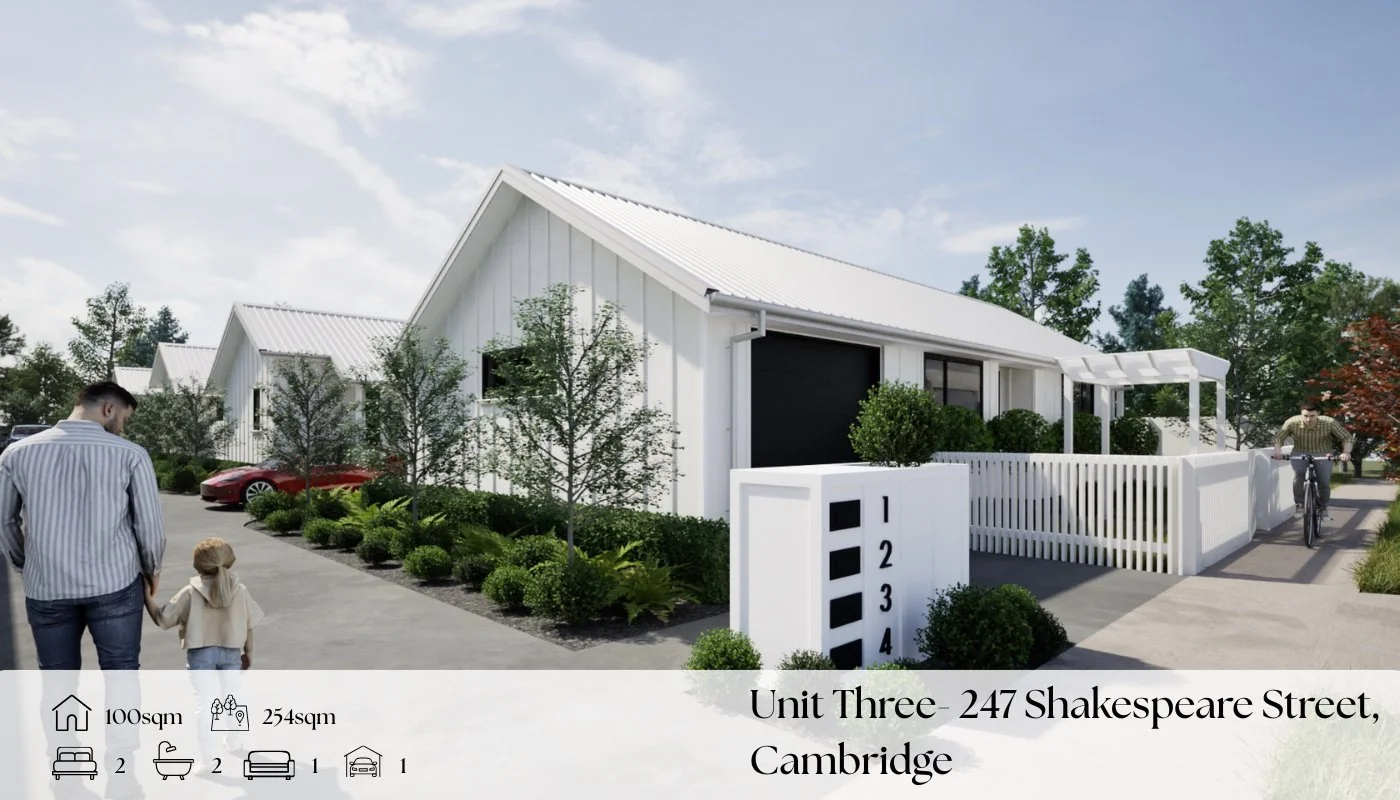 Modern white residential houses with gabled metal roofs, landscaping, and walking paths, located at 247 Shakespeare Street, Cambridge.