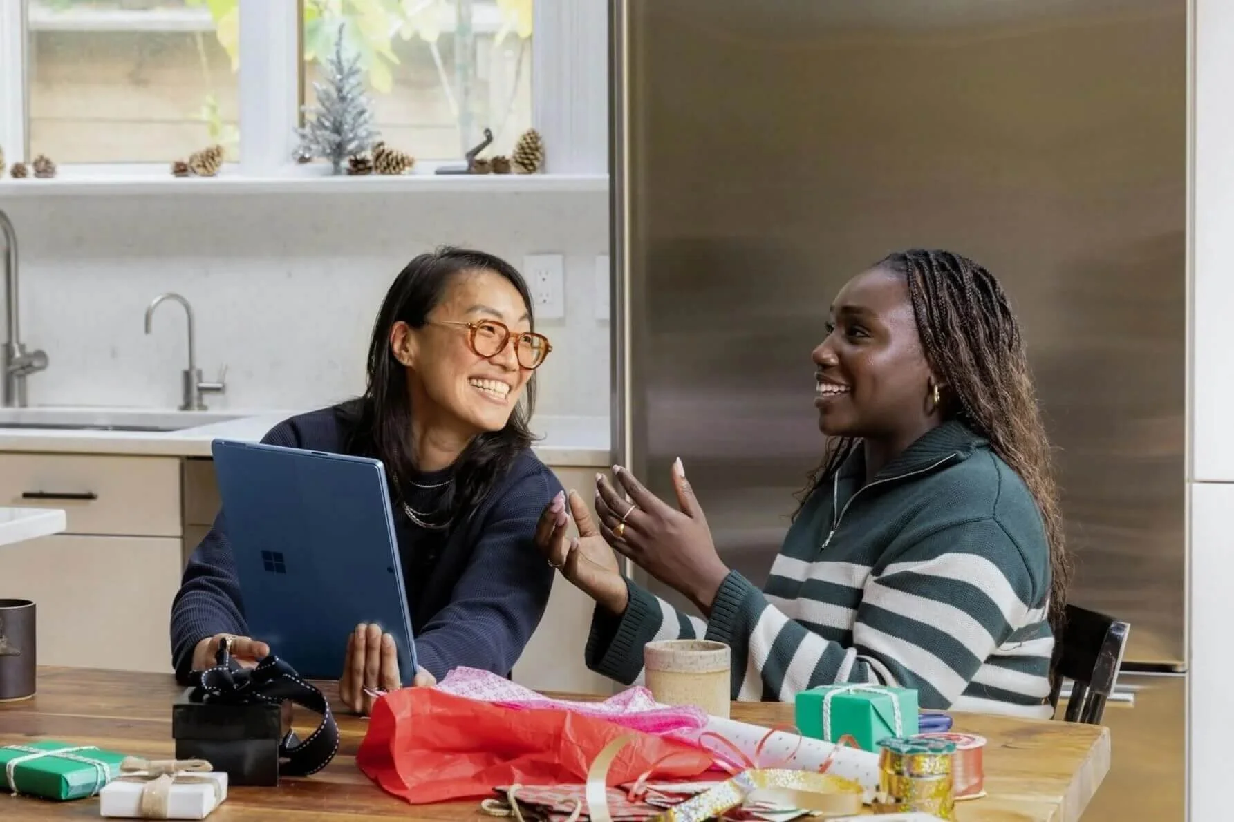 bipoc therapists oc person showing another person a tablet smiling at each other