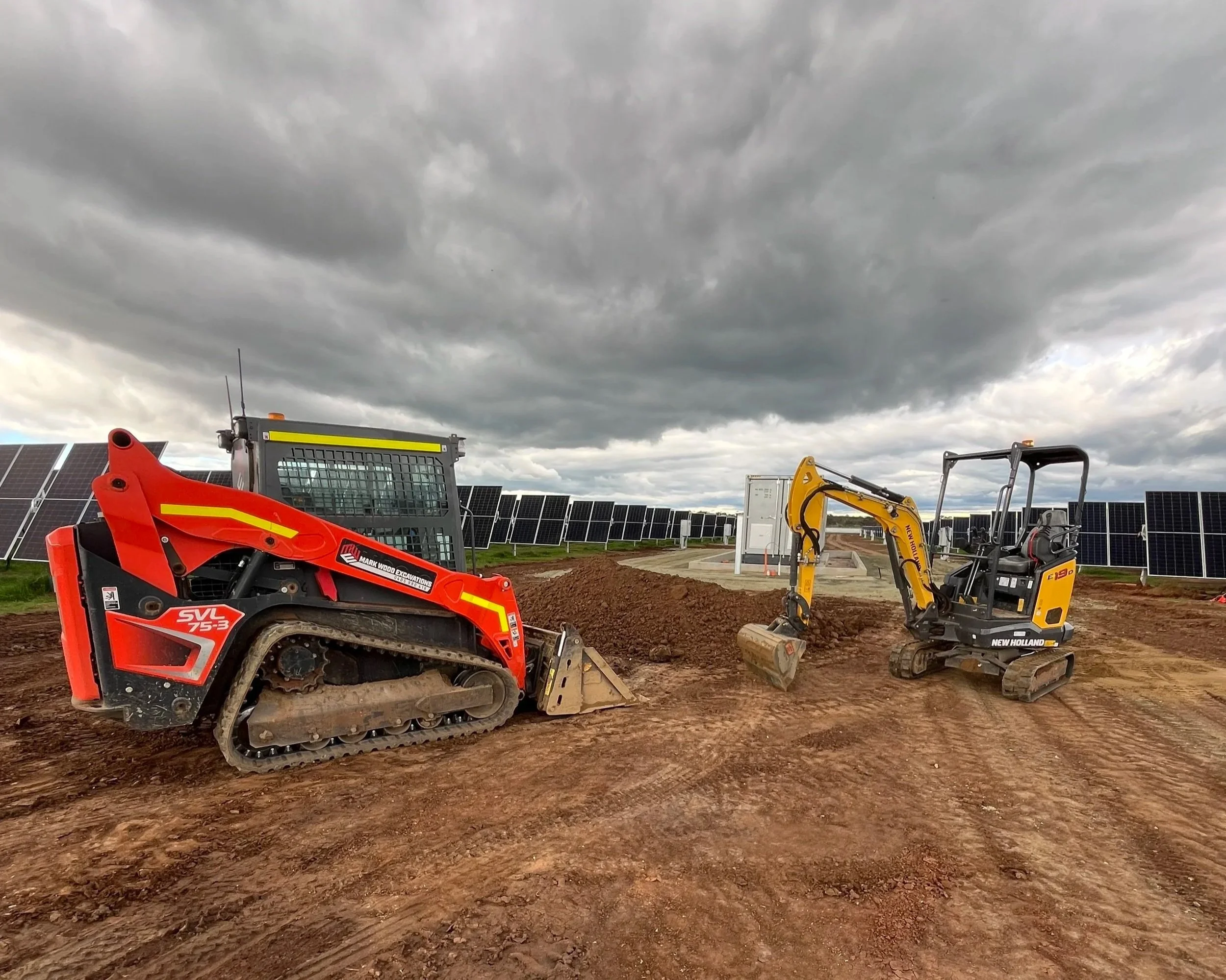 Bobcat and digger working on solar farm project