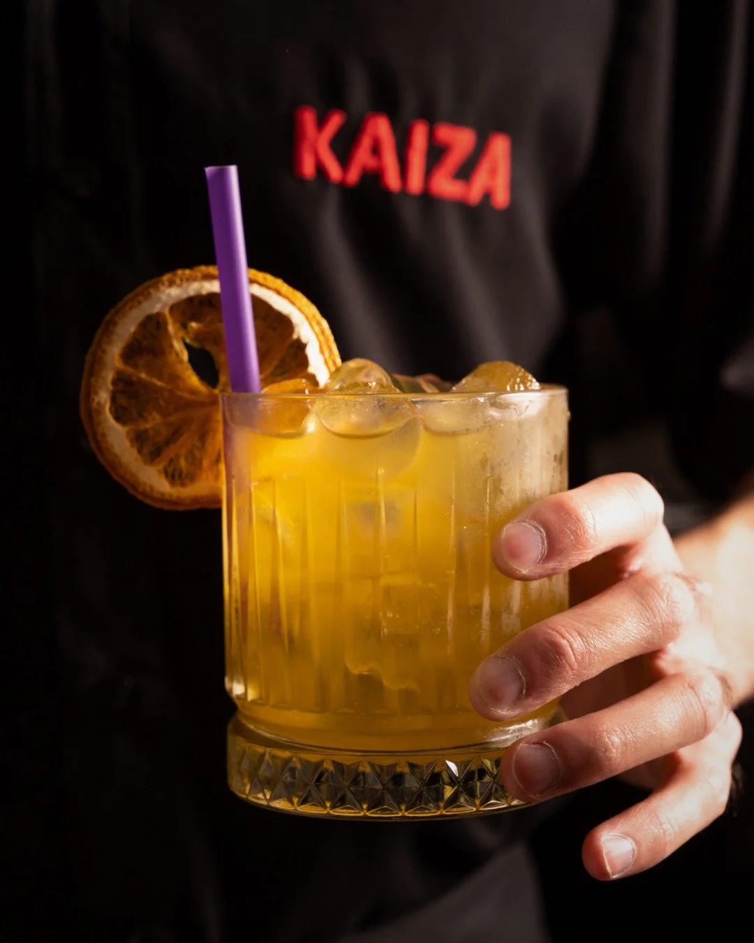 Dark nights deserve something stronger than candy. 
Kaiza Energy fuses Haku Vodka, spiced rum, and tropical fruit with Red Bull, giving each sip a mix of clean, sweet, and sharp notes that stay fresh to the last drop. It’s a drink made to keep