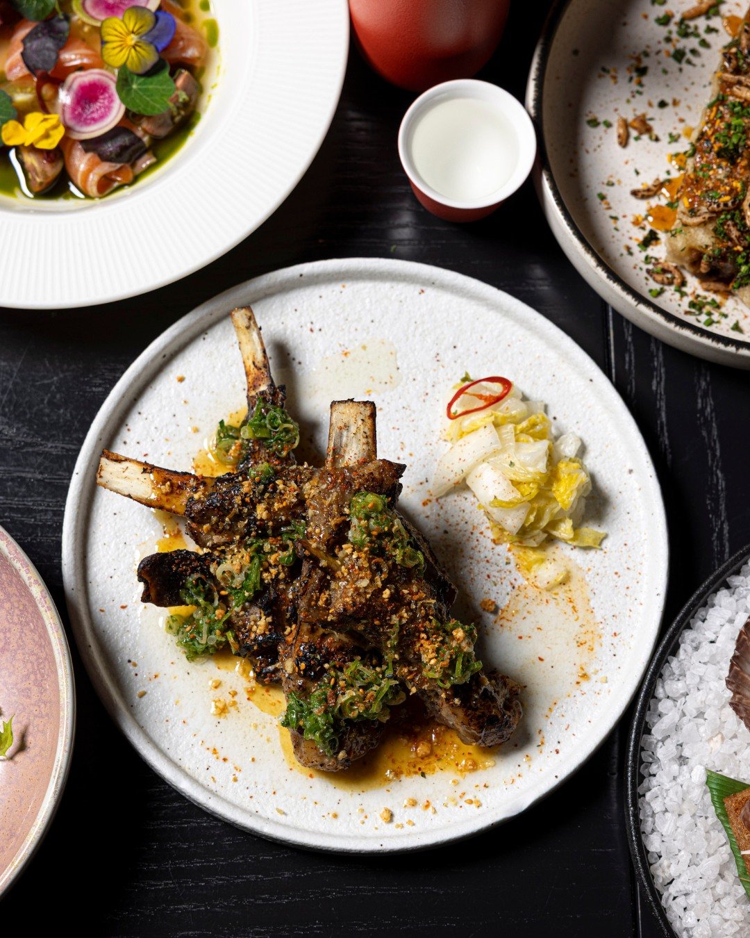 The Grill Lamb Ribs redefine what fusion can be: smoky, citrusy, and full of soul. 

Glazed with Yuzu Miso, topped with Negi Relish, and finished with a crunch of Peanut and Ito Togarashi, it&rsquo;s a dish that walks the line between Japanese restra