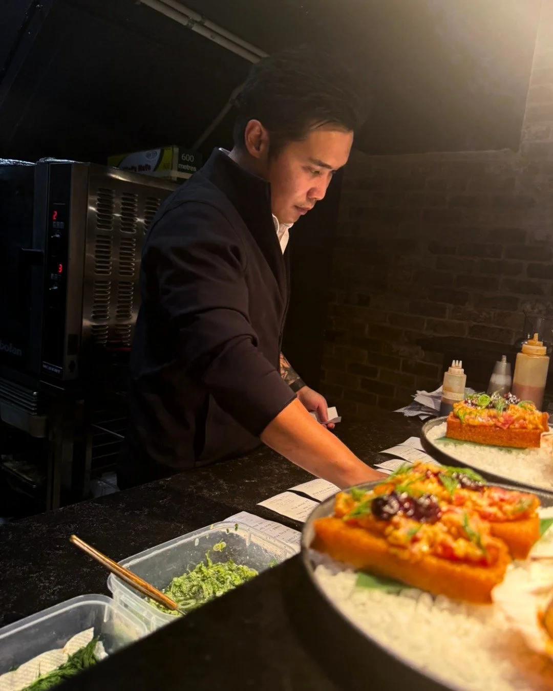 Behind every plate at Kaiza is Jason, a chef who approaches each dish with curiosity and care. 

He starts the week with a kitchen of charcoal, fresh herbs, and simmering broths, crafting Japanese-inspired dishes infused with bold Vietnamese flavours