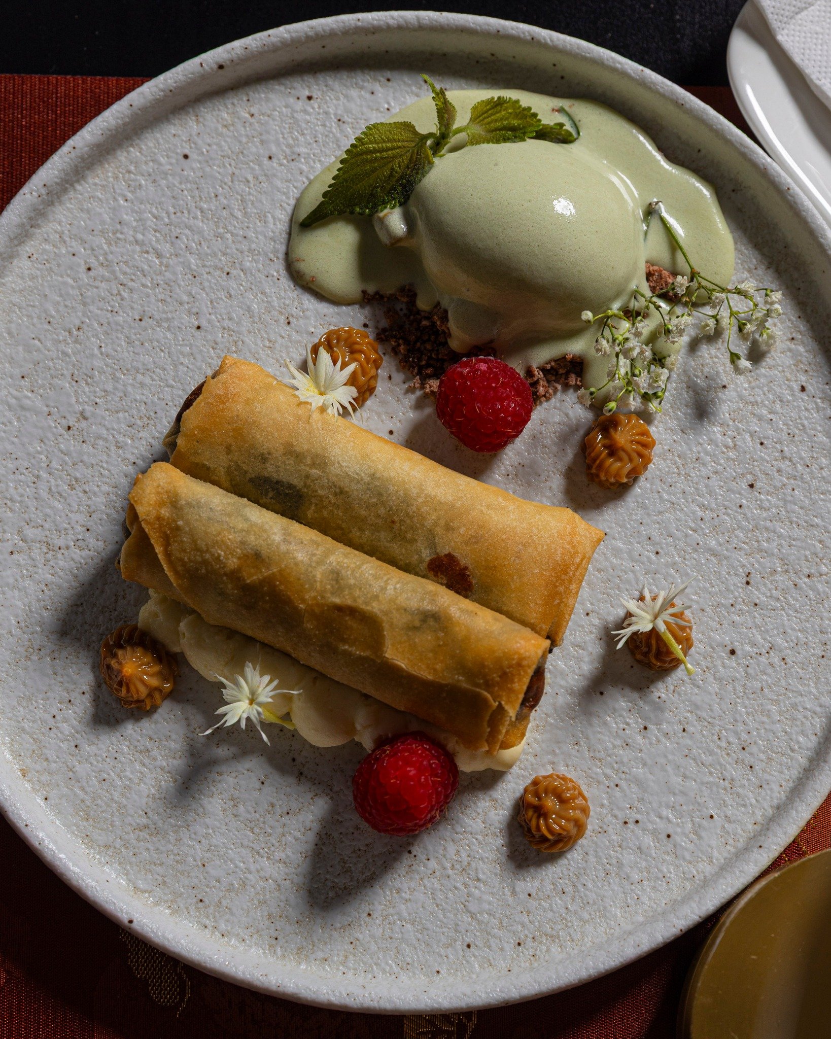 End on something warm.

Chocolate Harumaki pairs Callebaut chocolate with banana, shiso, dulce de leche, and kurogoma. It&rsquo;s rich without being heavy, wrapped crisp, and served as a proper finish rather than an afterthought.

Order one for the t