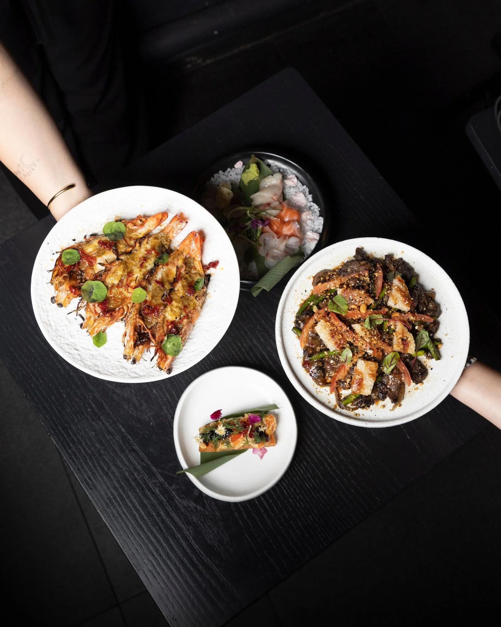 A full table reflects what Kaiza is built around.

The menu draws from Vietnamese heritage and Japanese technique, moving through seafood, grilled dishes, and balanced flavours designed for sharing. Each plate plays a role in shaping the experience a