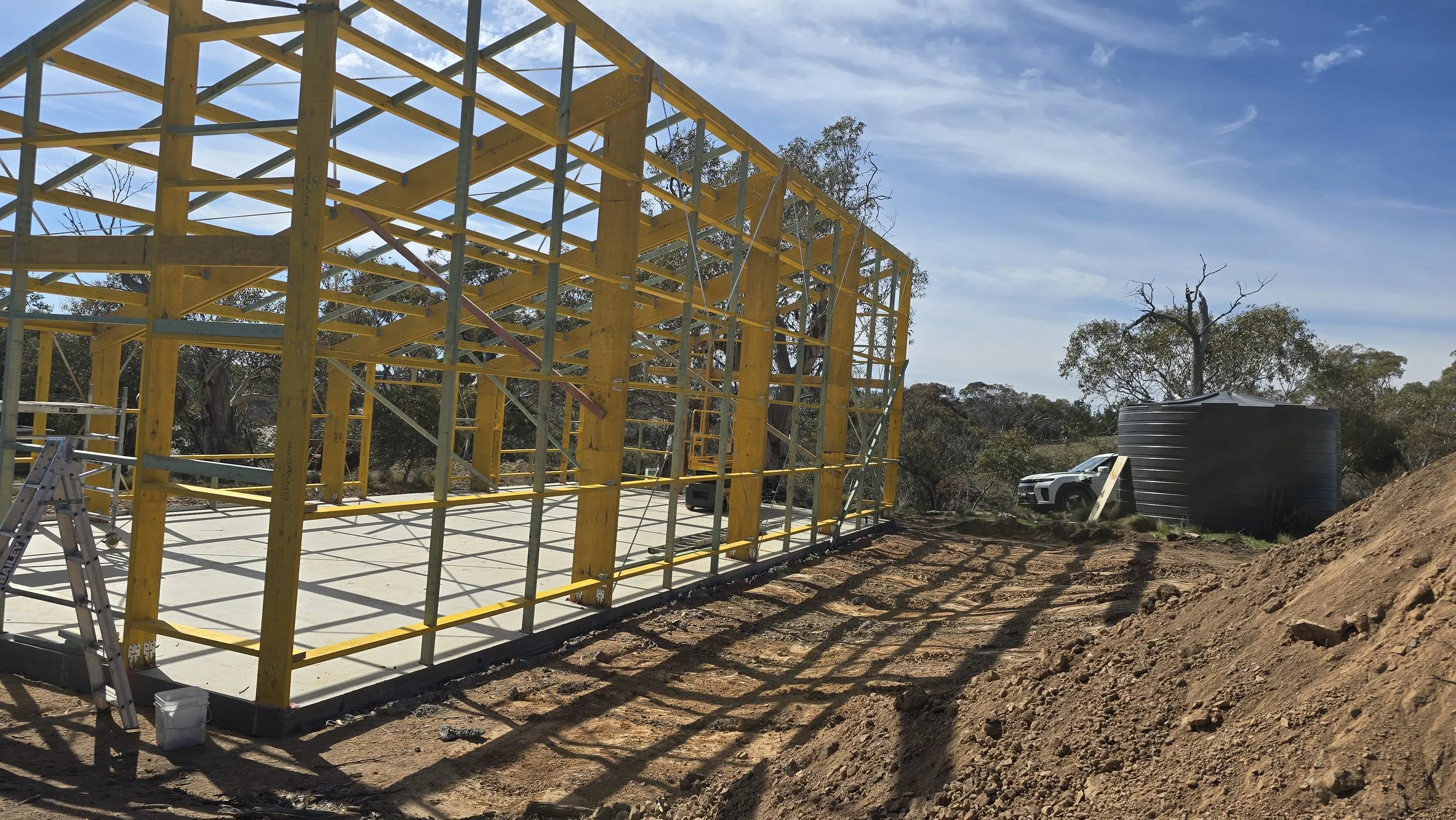 Engineered timber portal frame shed under construction near Jindabyne