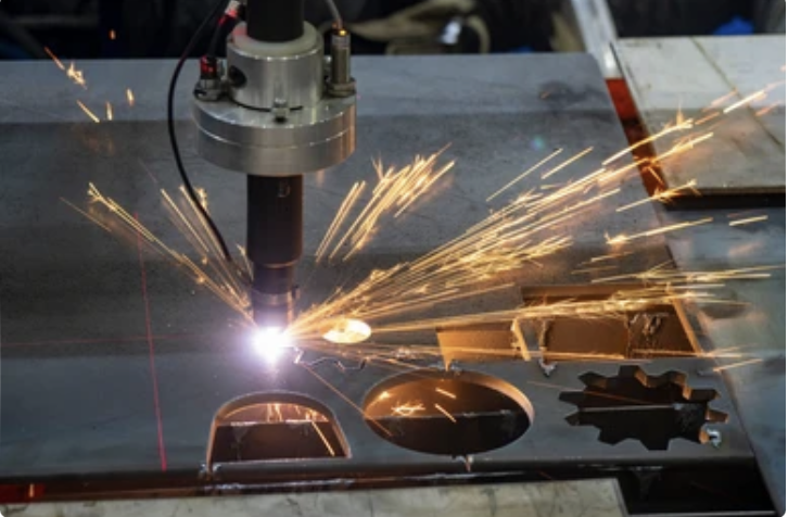 A welding robotic arm welding metal in a workshop, with sparks flying as it works on a metal sheet.