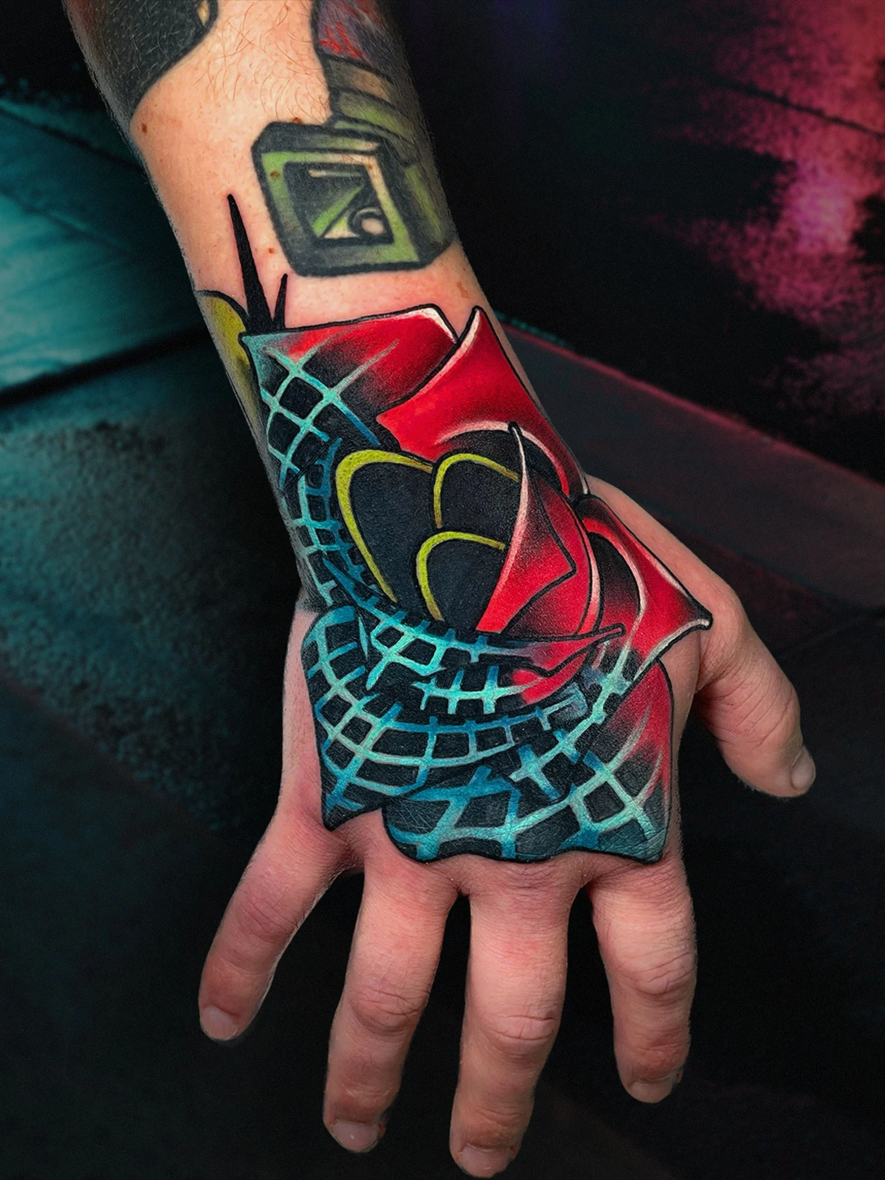 Cyber rose hand tattoo with bold color by Evansville Indiana tattoo artist Shane Klos