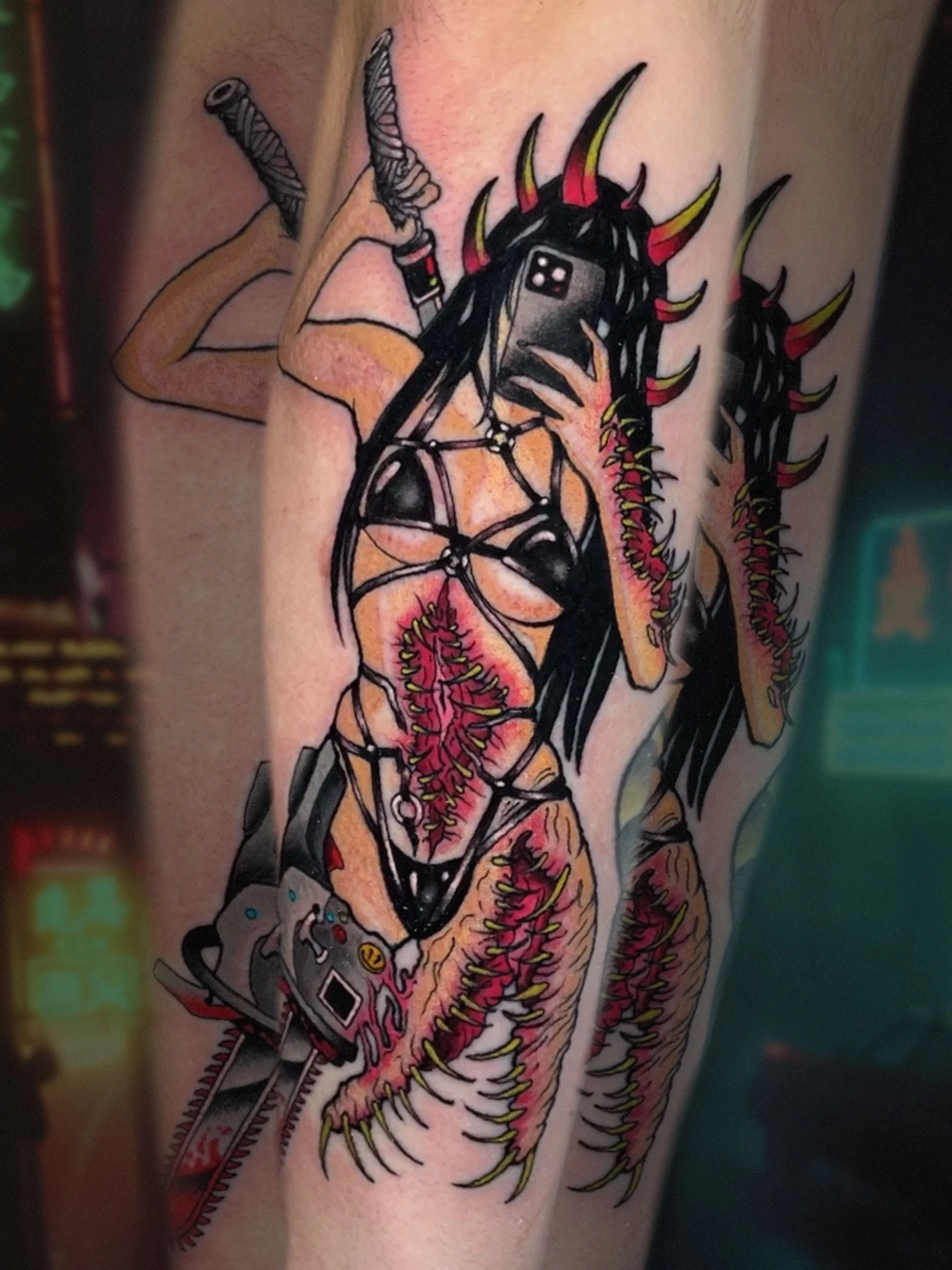 Horror demon girl tattoo holding a phone selfie, neo-traditional horror tattoo by Evansville artist Shane Klos.