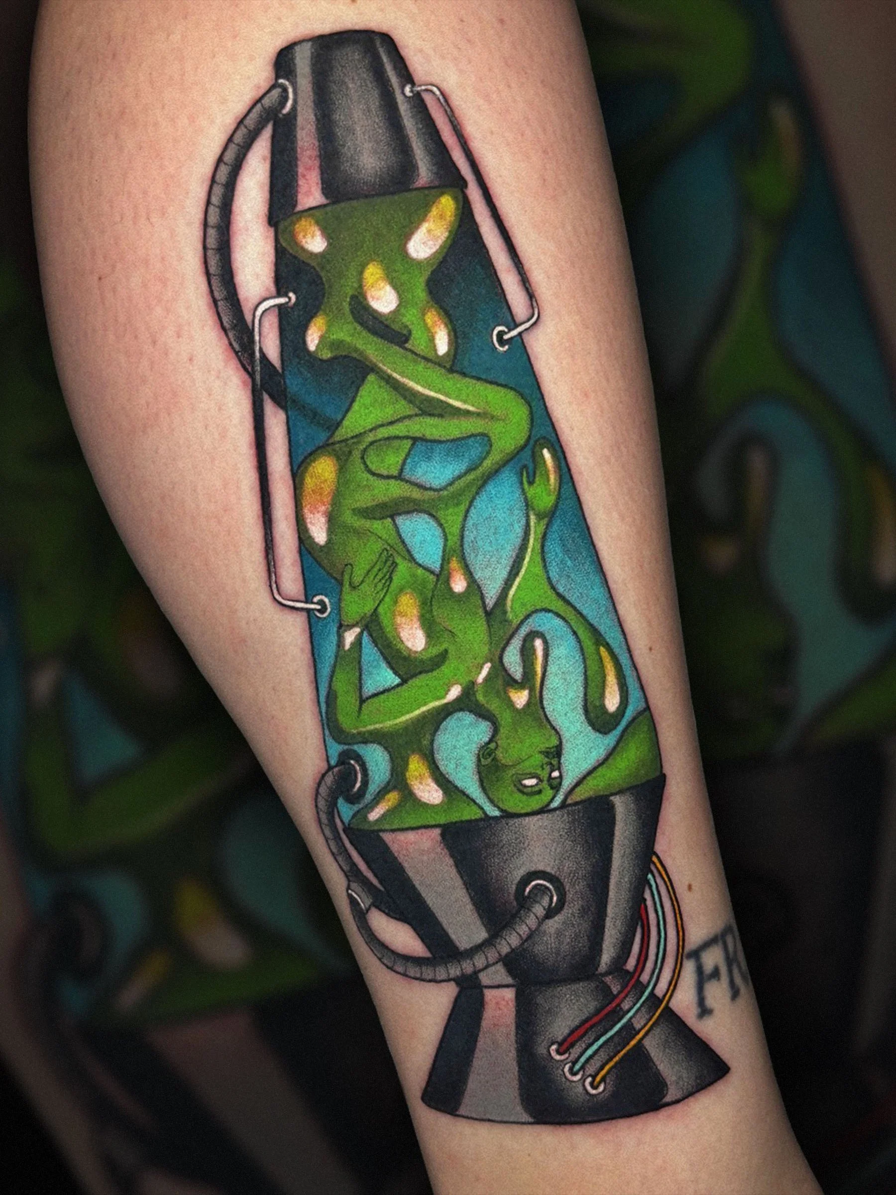 Neo-traditional lava lamp girl tattoo with psychedelic color palette, tattooed by Evansville tattoo artist Shane Klos.
