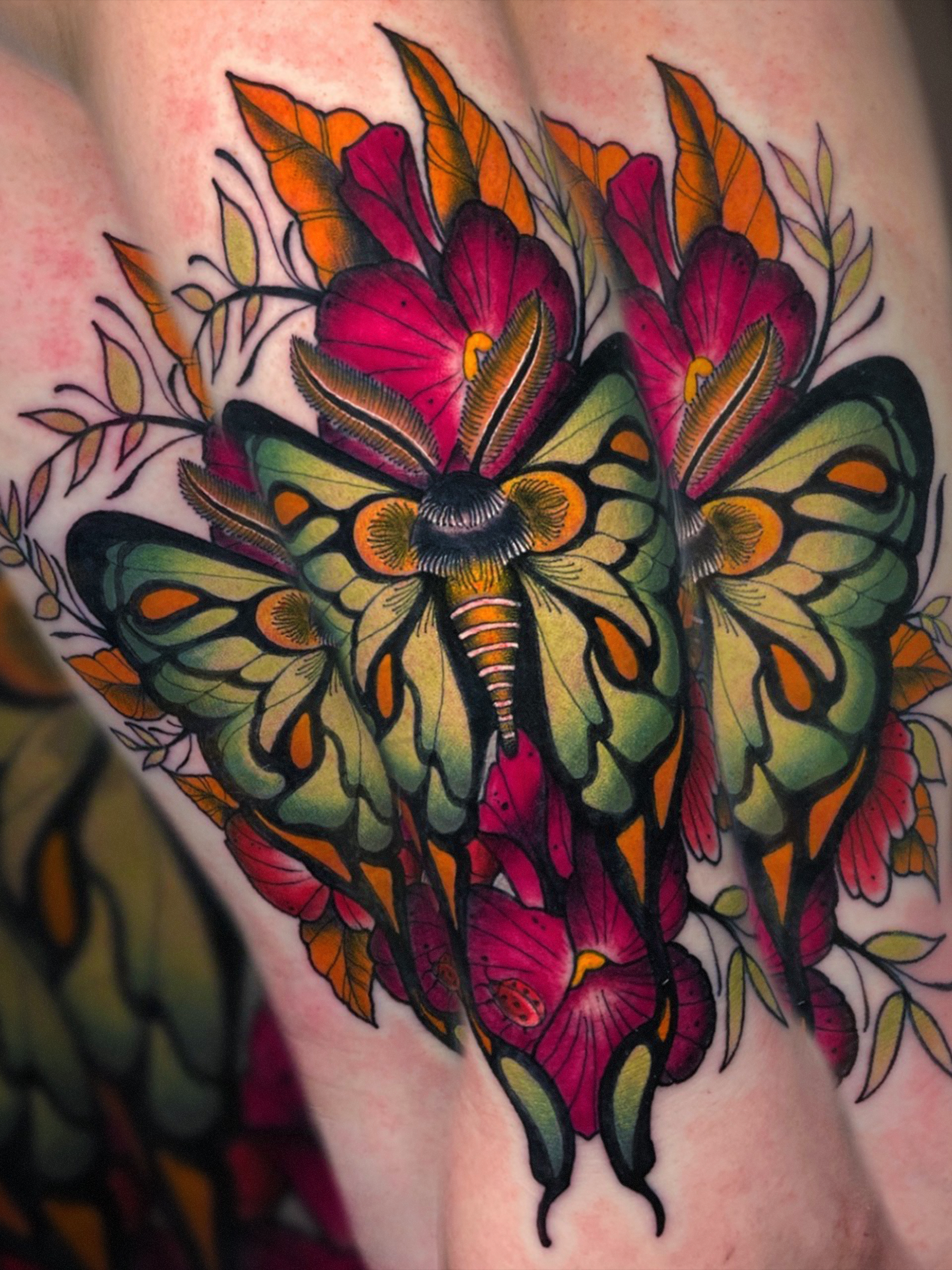 Neo traditional moth and floral tattoo by Evansville Indiana tattoo artist Shane Klos