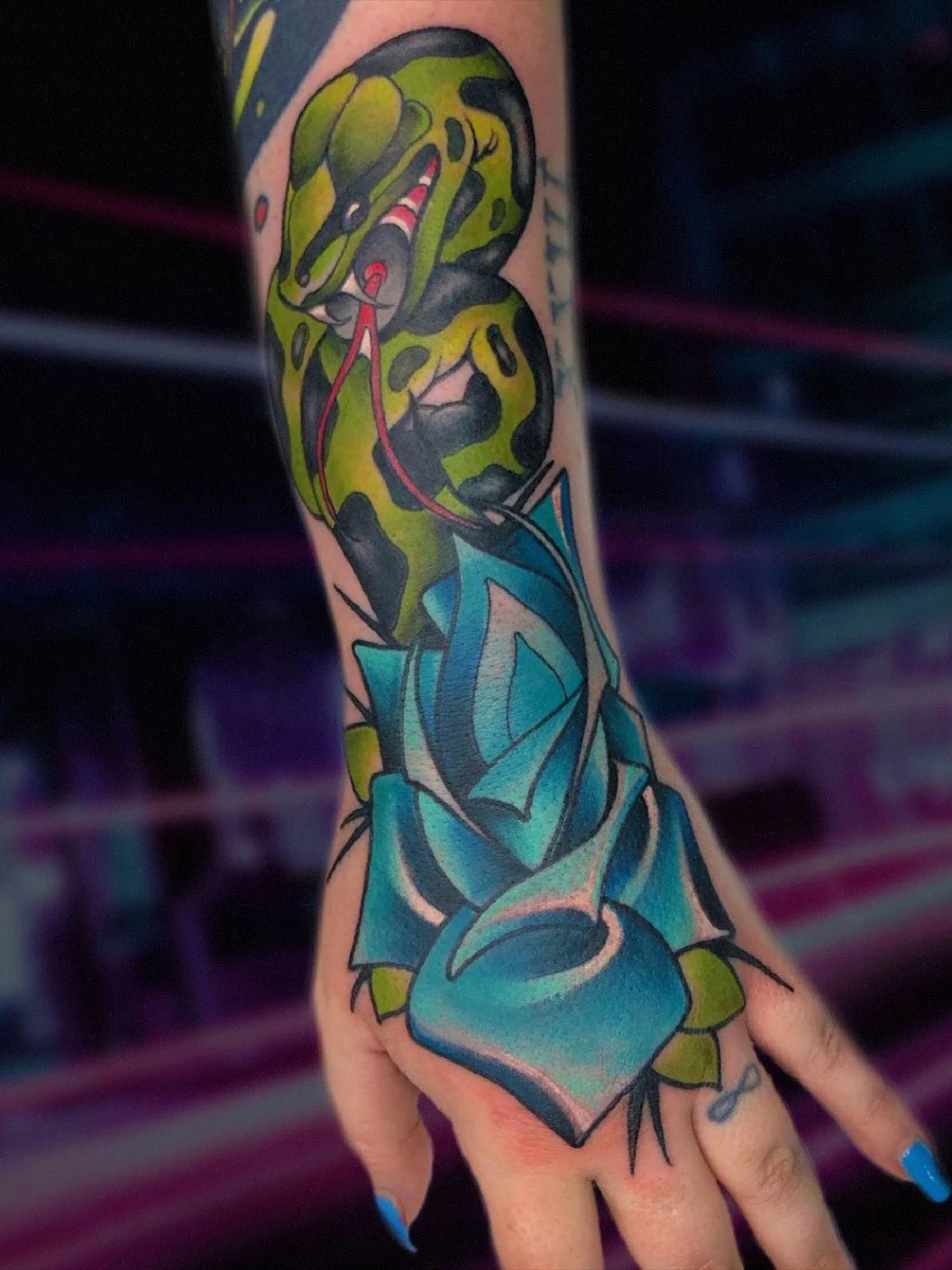 Snake and rose neo traditional hand tattoo by Evansville Indiana tattoo artist Shane Klos