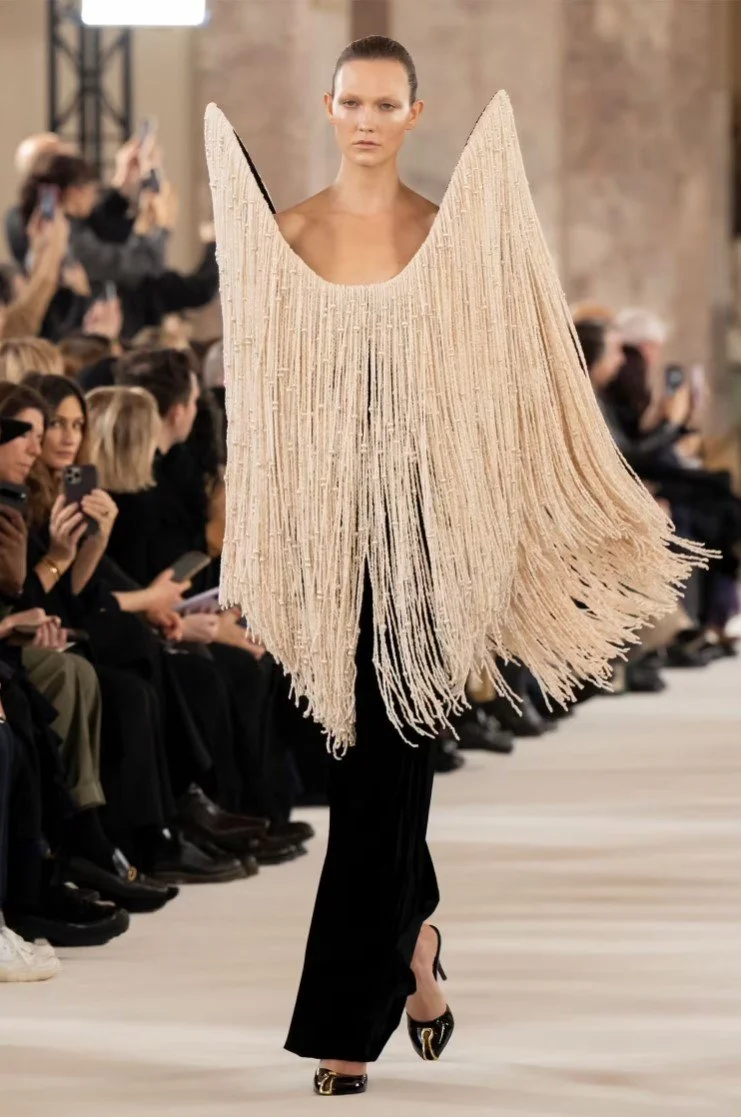 schiaparelli---haute-couture---spring-summer-2024-black-dress-with-a-nude-fringe-.jpg