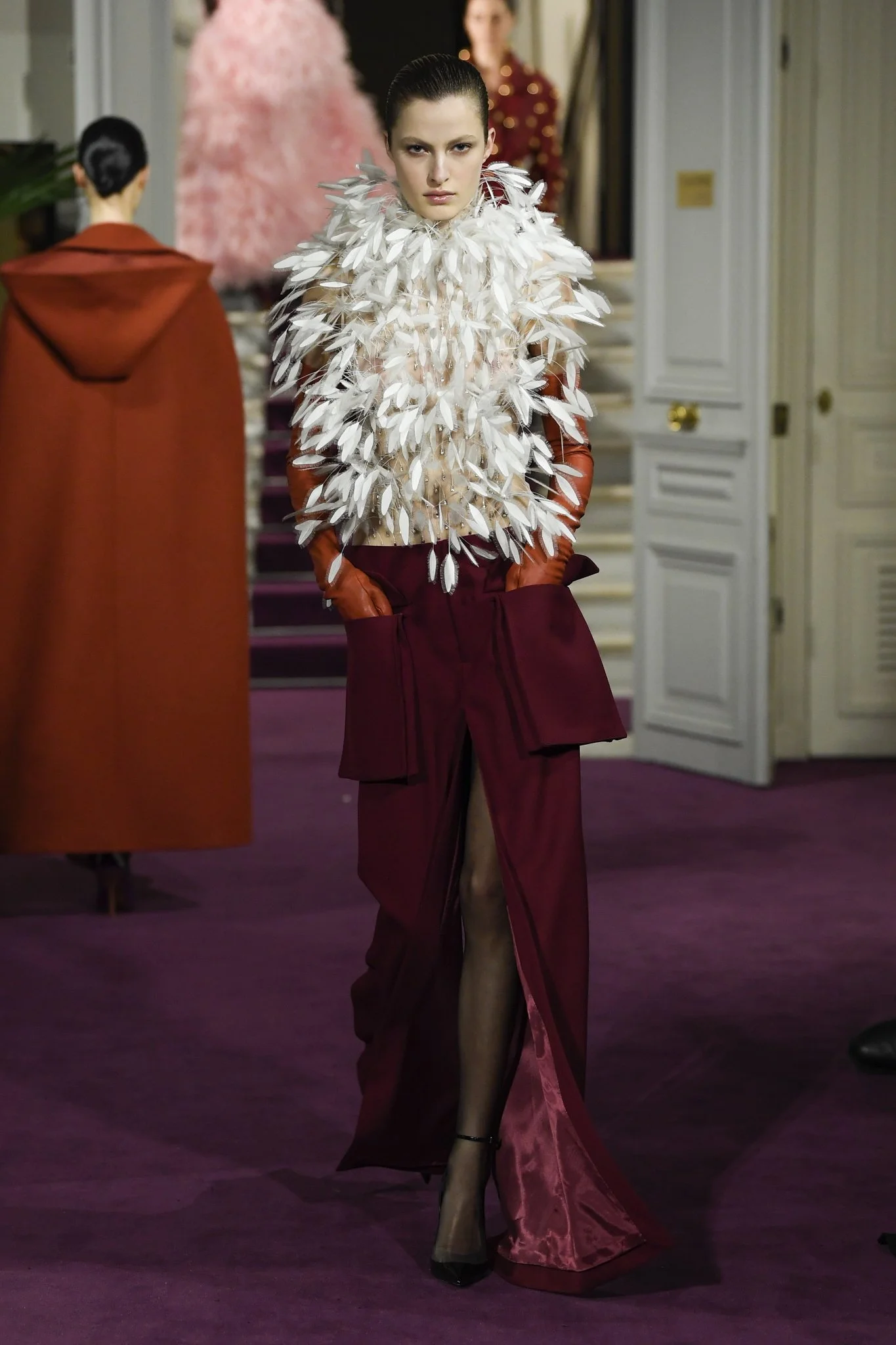 valentino-white-feathers-top-and-burgundy-trousers-with-accentuated-large-front-pockets,-paired-with-leather-gloves.jpg