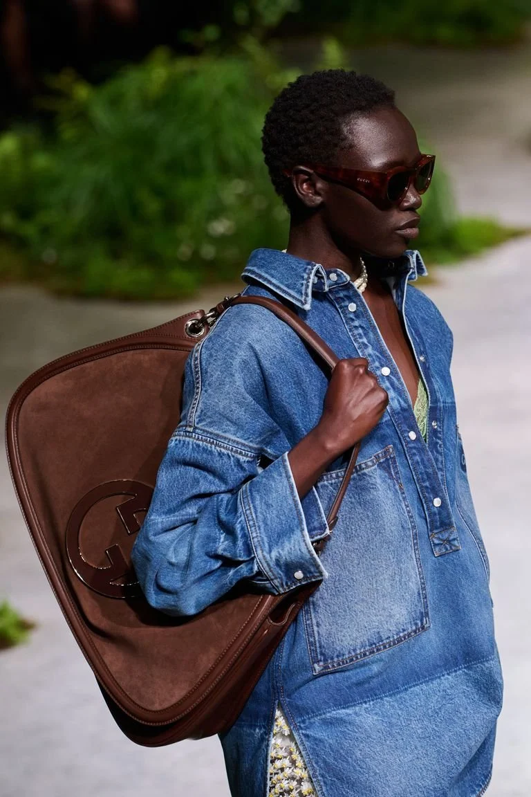 a-new-gucci-blondie-suede-bag-was-revealed-at-the-gucci-cruise-2025-show-in-a-dark-red,-brown-colour-with-a-huge-gg-label-on.jpg