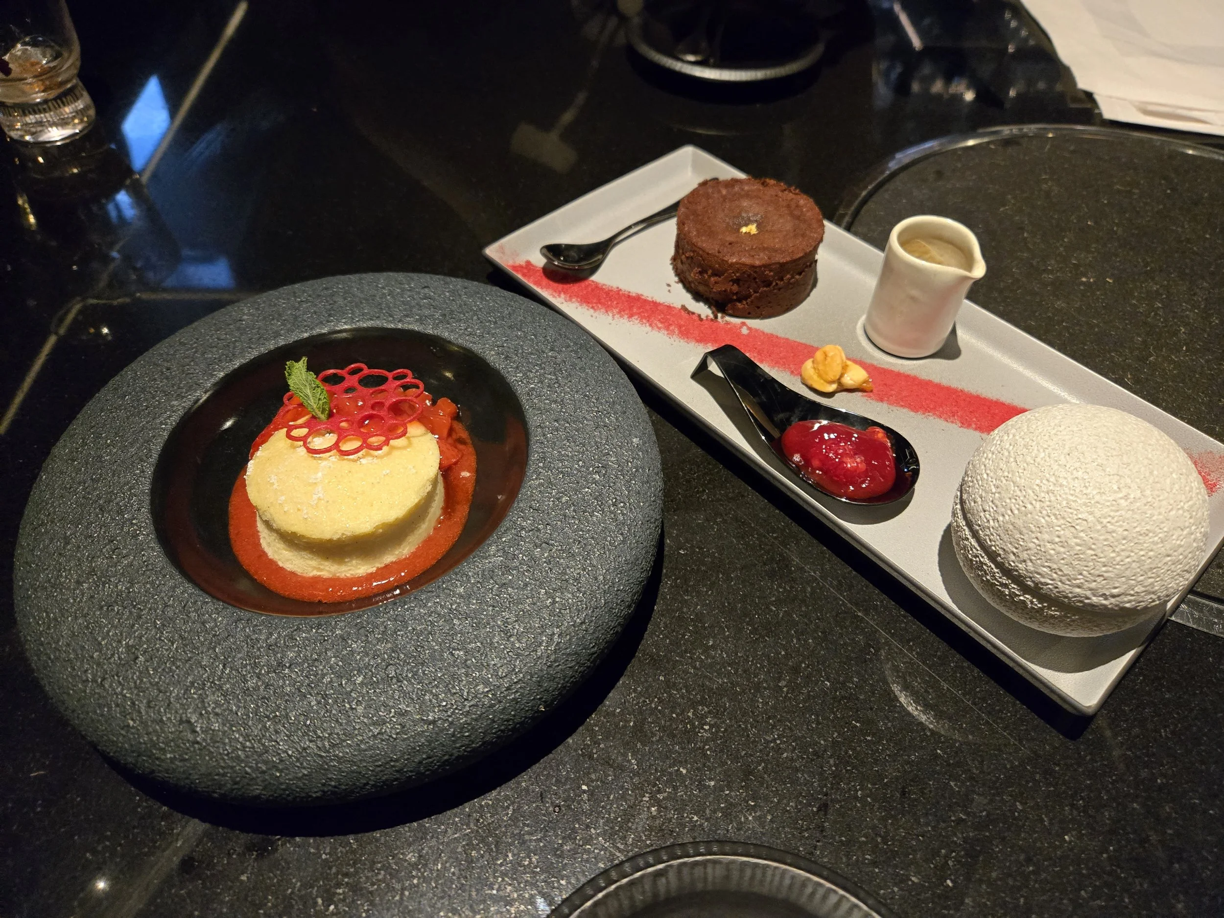 dark chocolate soufflé, crowned with strawberry powder, raspberry jam, and delicate chocolate flakes at Kanpai Classic Soho