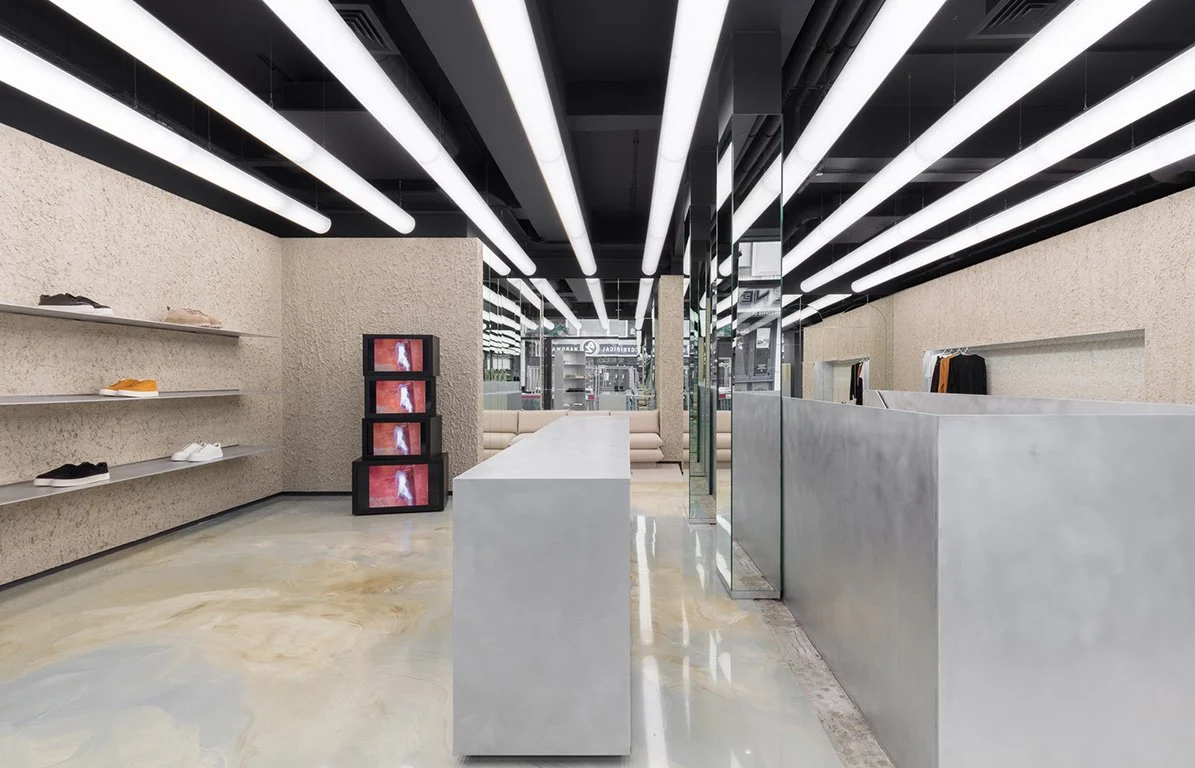 Eytys Soho store interior featuring chunky sneakers and minimalist unisex fashion in London.