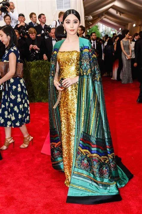Fan Bingbing wearing a jade-embroidered Christopher Bu cape at the 2015 Met Gala