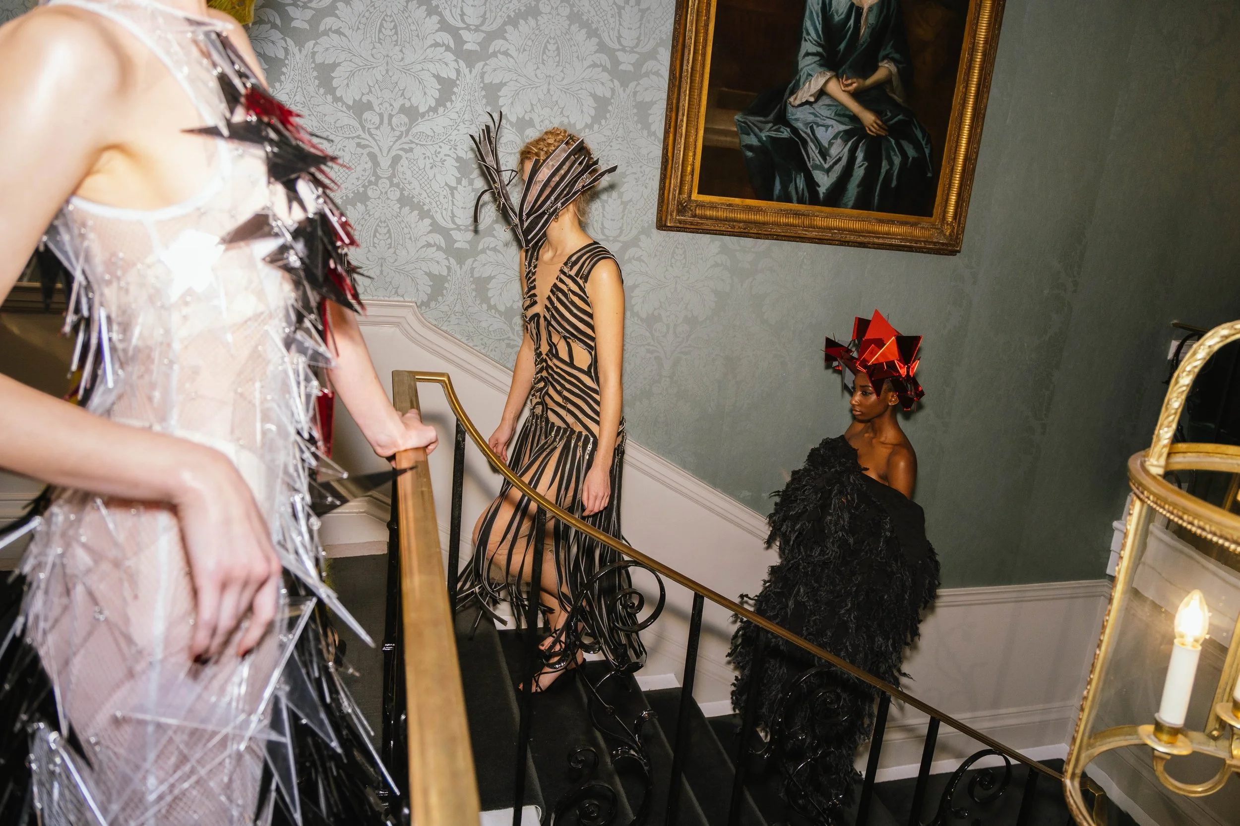 Models walking up the stairs at 30 Knightsbridge hotel at the Genaro Rivas Show