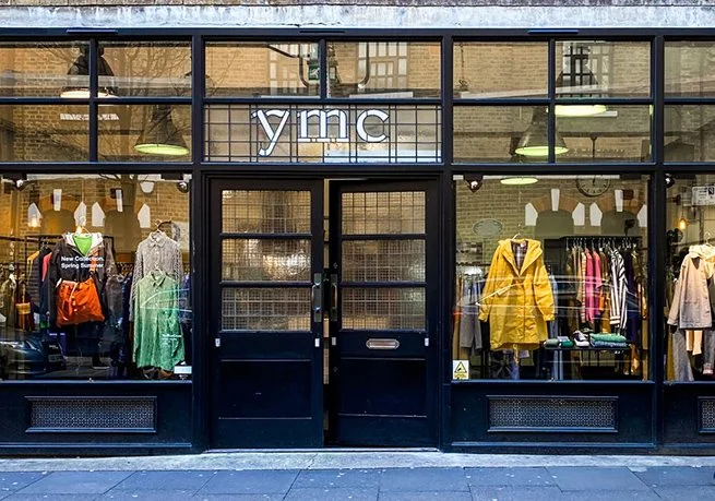 YMC Soho store interior featuring minimalist British fashion and timeless contemporary menswear design.