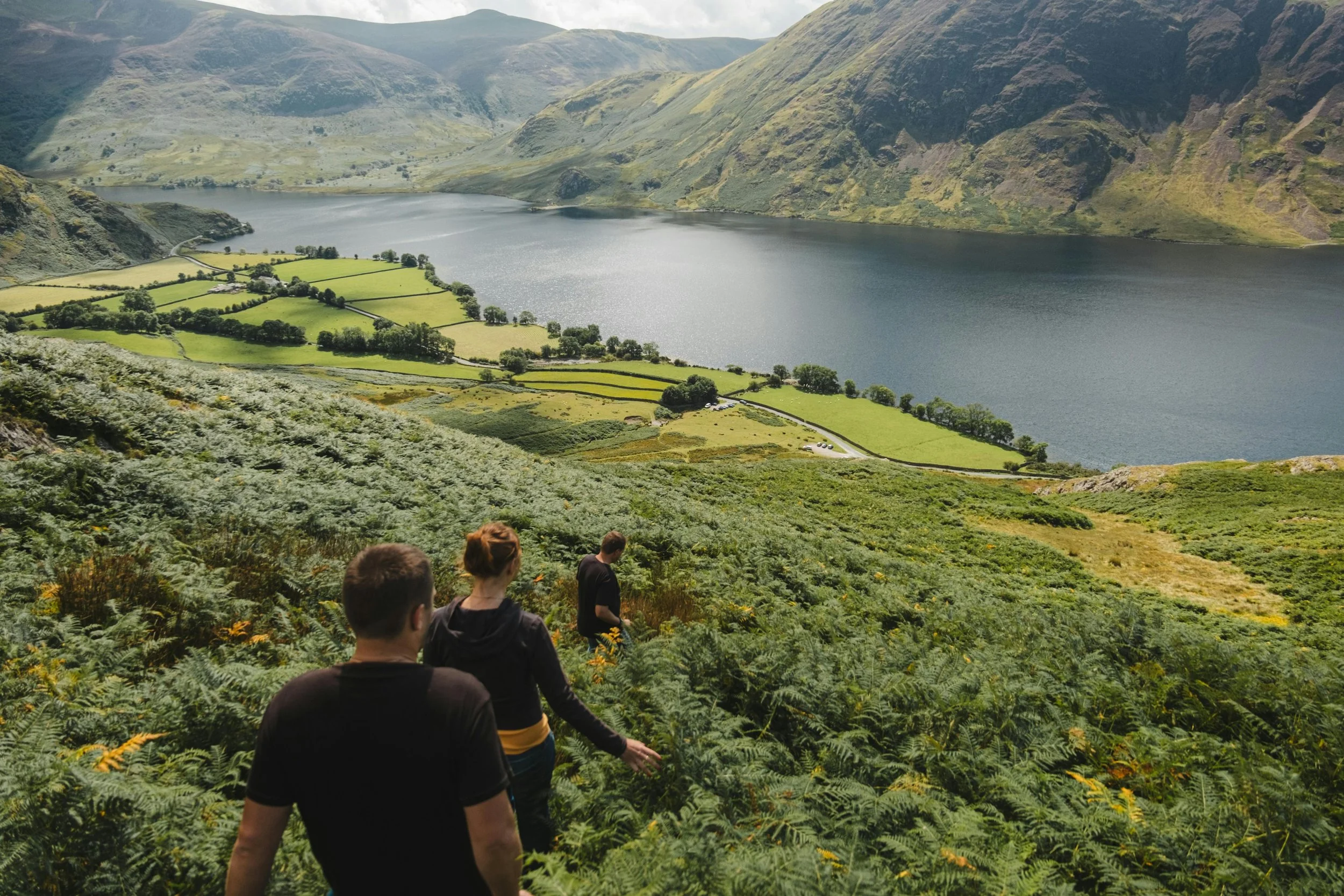 people walking down lake district fells
