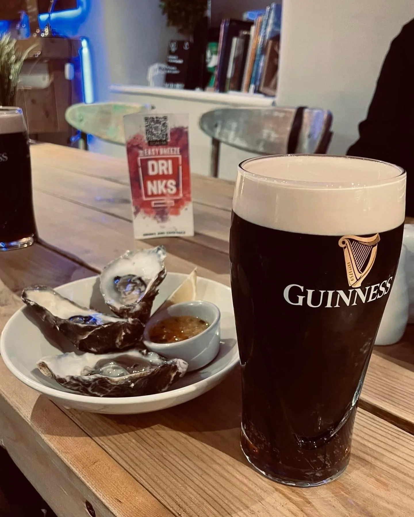 A pint of Guinness beer, oysters, the easy breeze