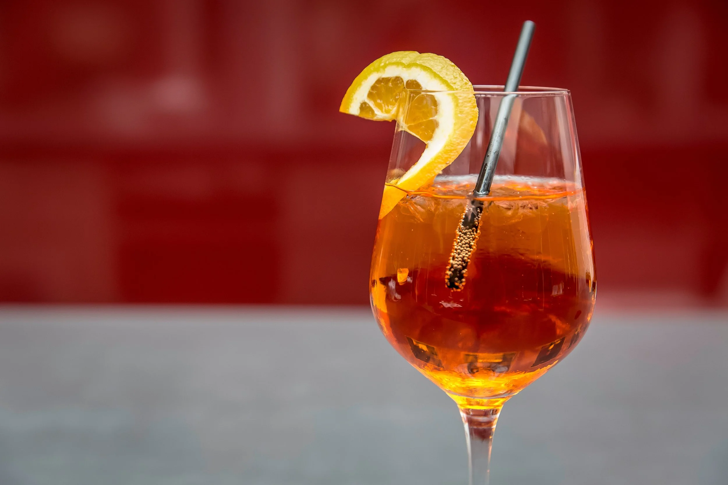 glass with aperol and orange