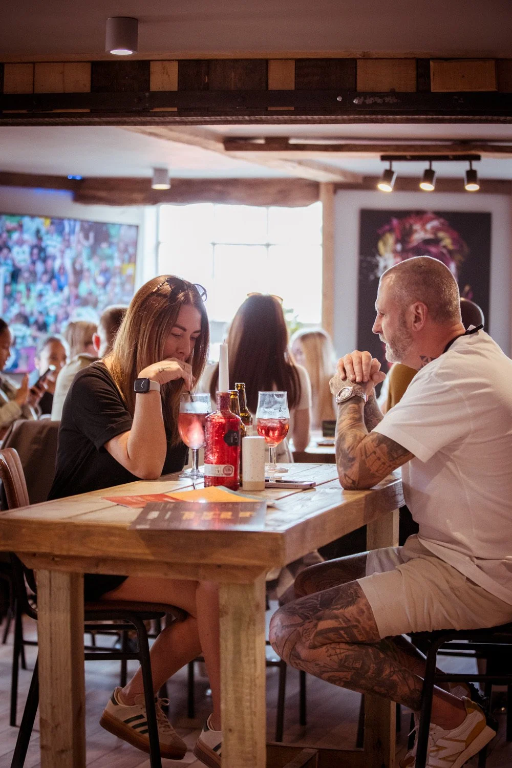 customers enjoying drinks in the back bar section of the breeze