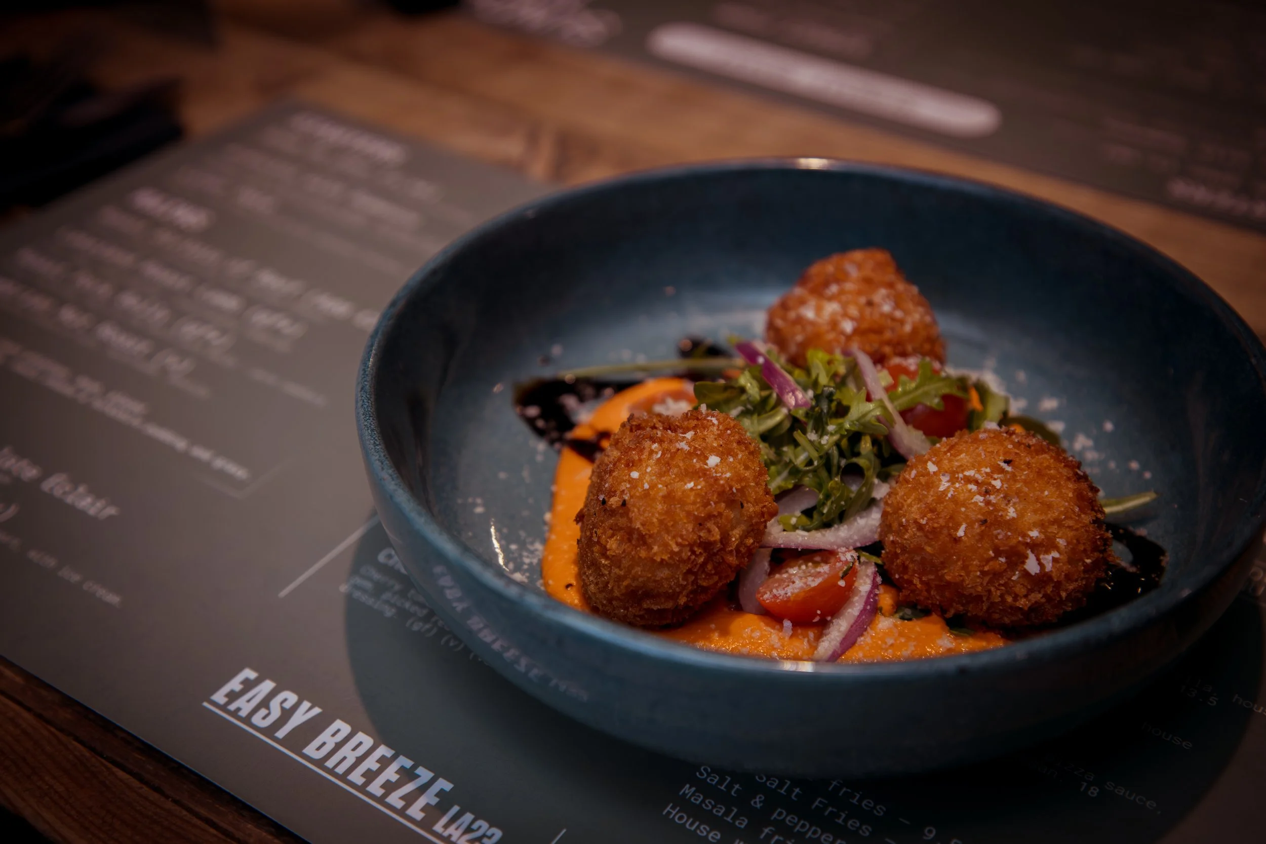 sunday starter before a roast dinner 
ARANCINI WITH ROMESCO
Golden risotto balls with a smoky roasted red pepper & almond romesco, finished with herb oil & parmesan. (ve alternative available)