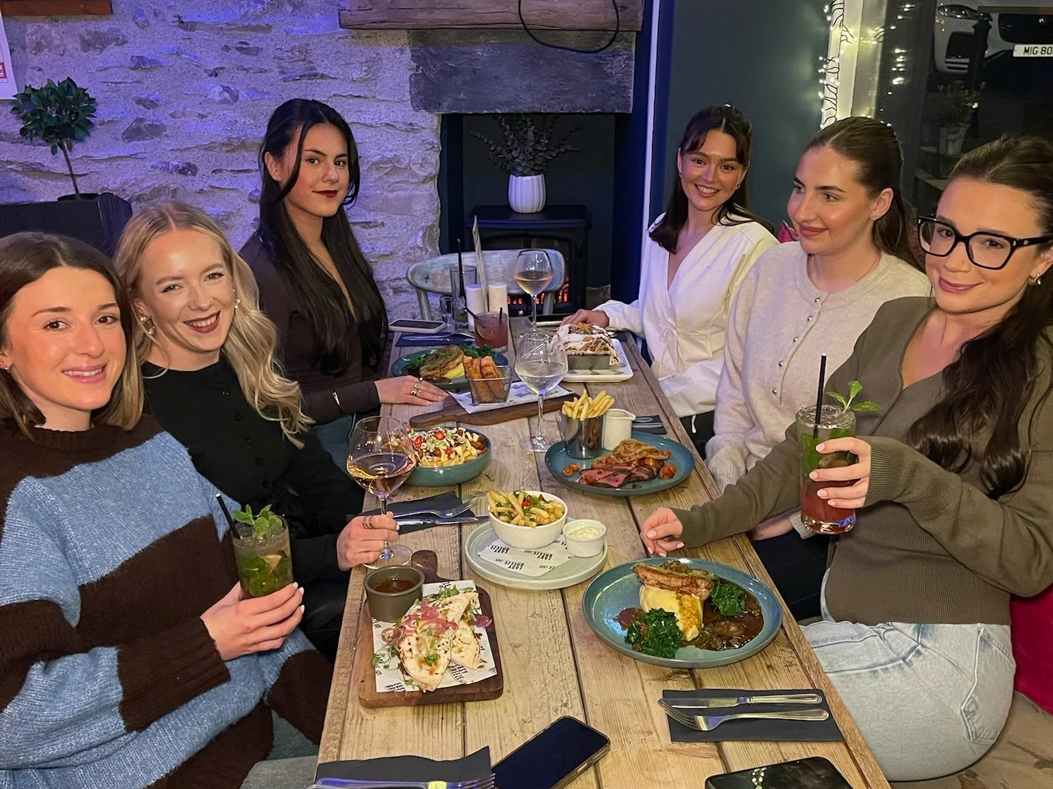 girls enjoying a meal in the easy breeze