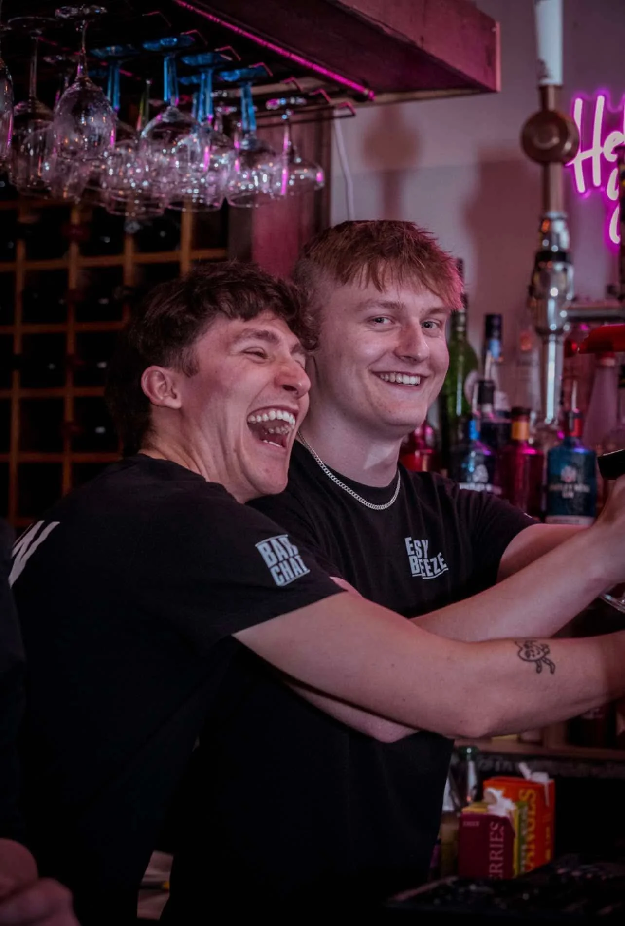 happy employees at the easy breeze working behind the bar