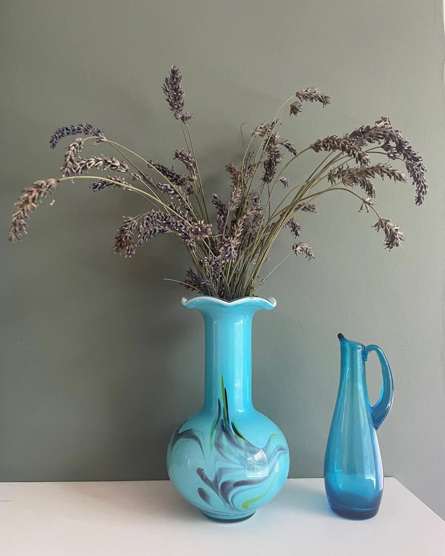 Lavender and blue glass vases.