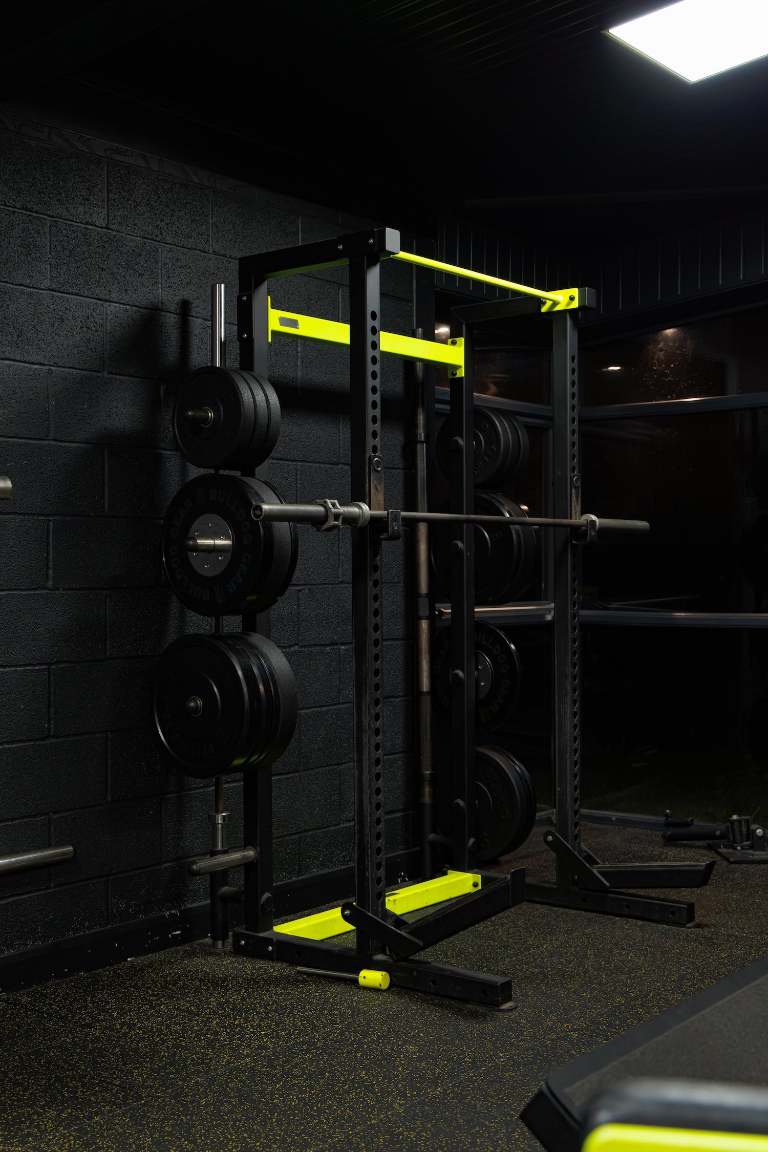 A black and yellow Smith Machine at Alpha Athletic 