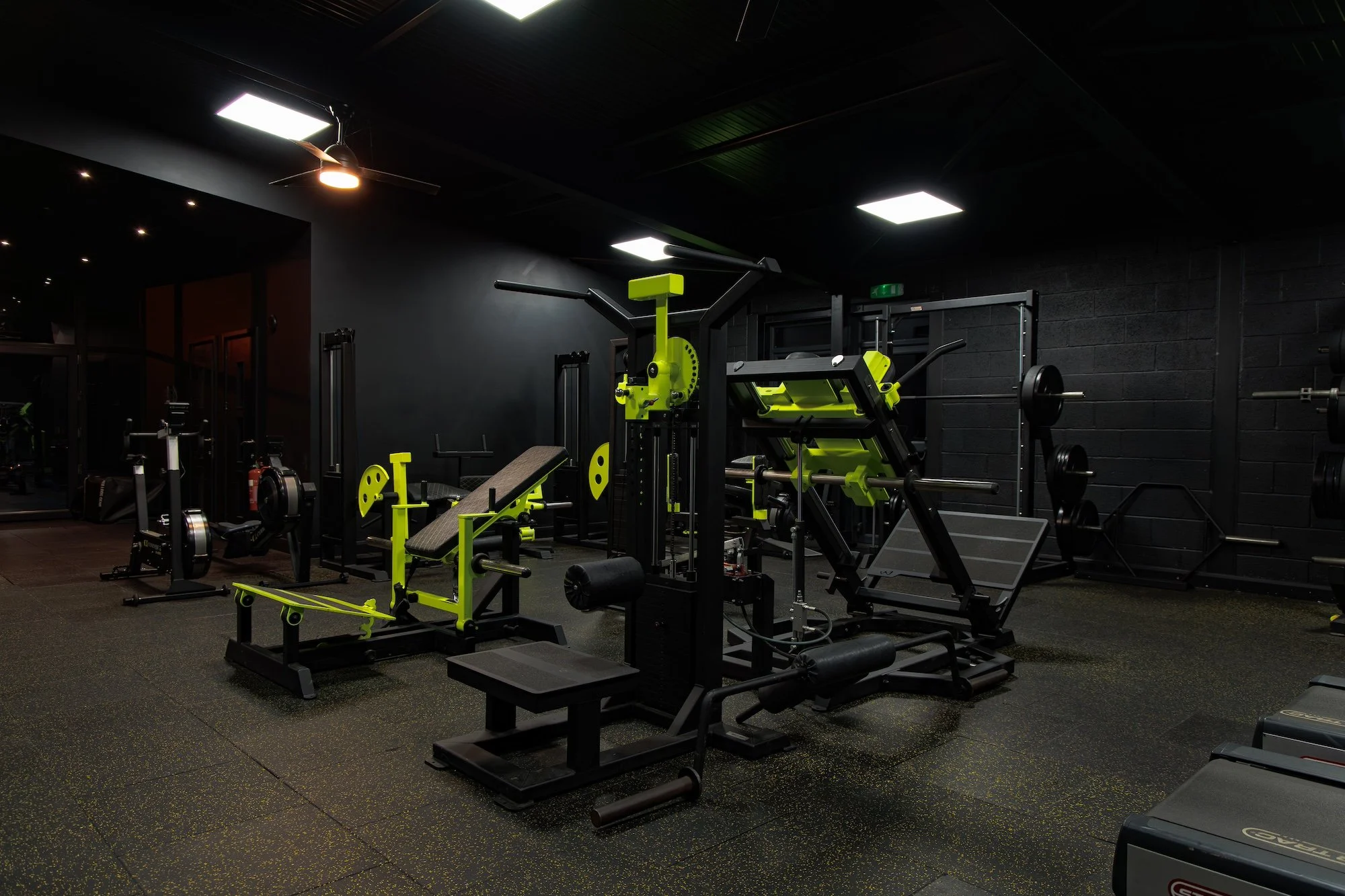 Bespoke training machines and black interior at Alpha Athletic.