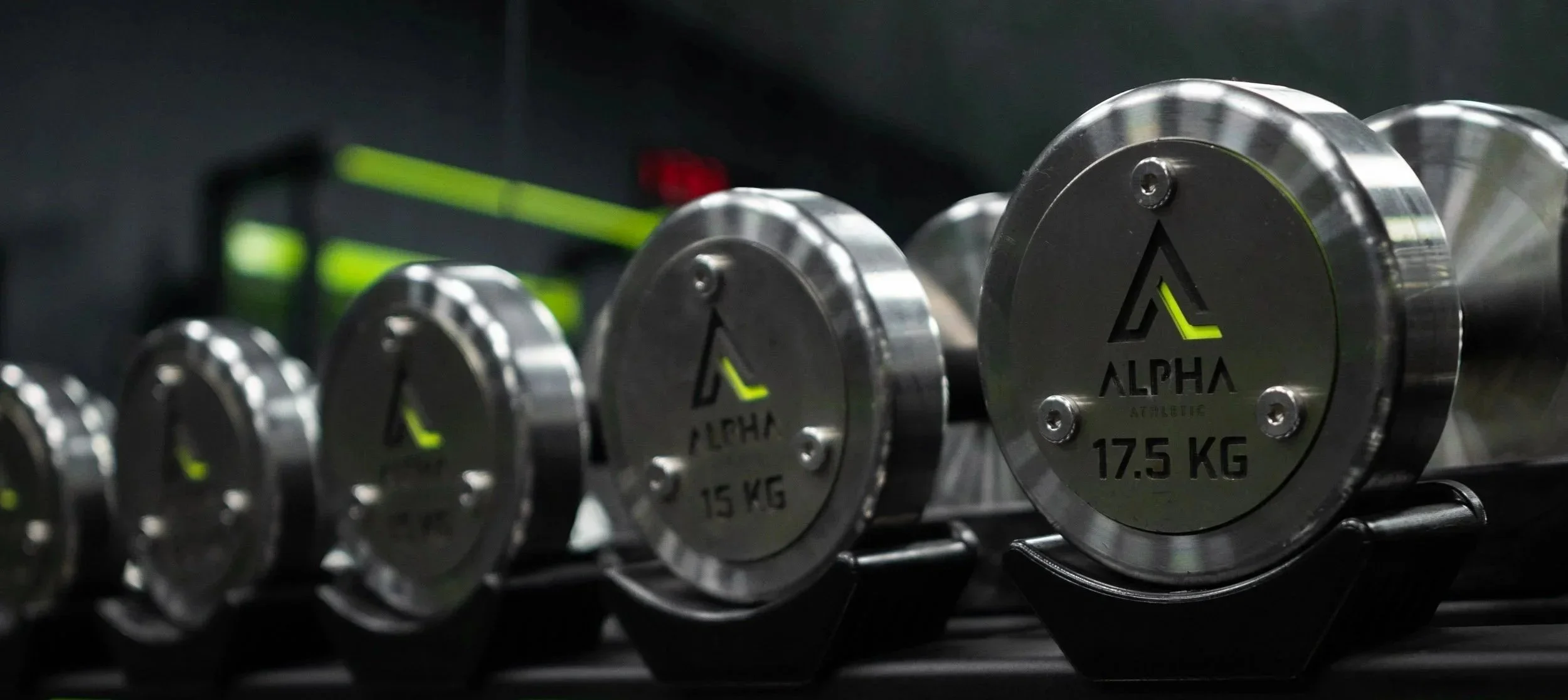 A rack of silver dumbbells at Alpha Athletic gym.
