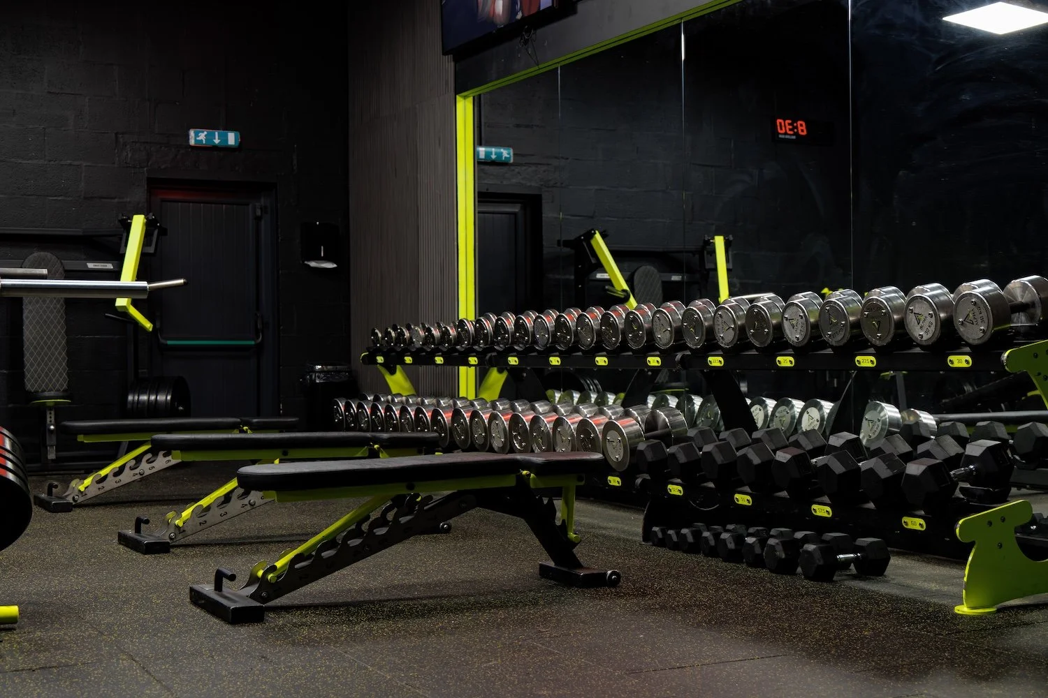 A silver weight rack at Alpha Athletic Gym.