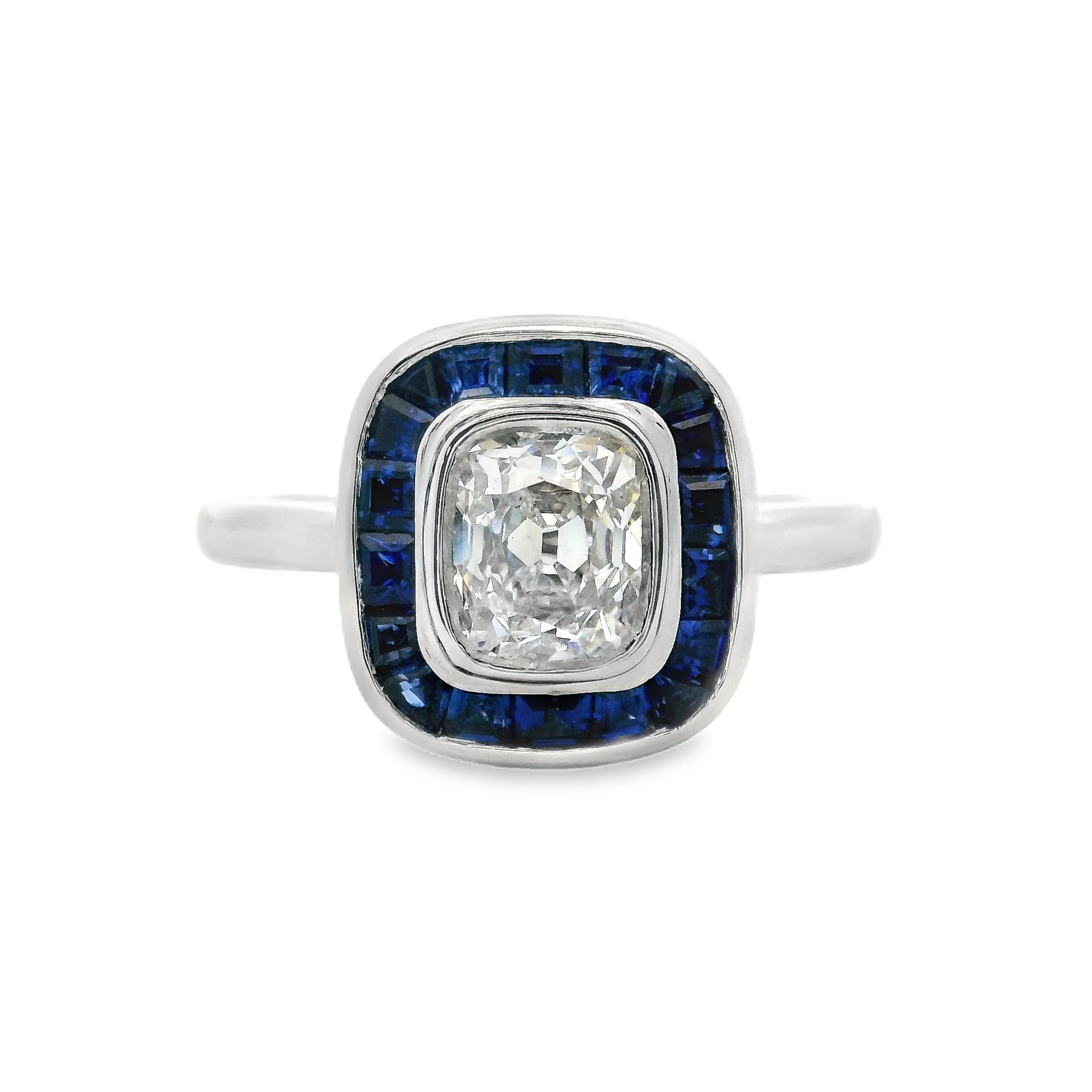 Platinum Bezel Set Cushion Old Mine Cut Diamond & Calibré Cut Sapphire Halo Ring