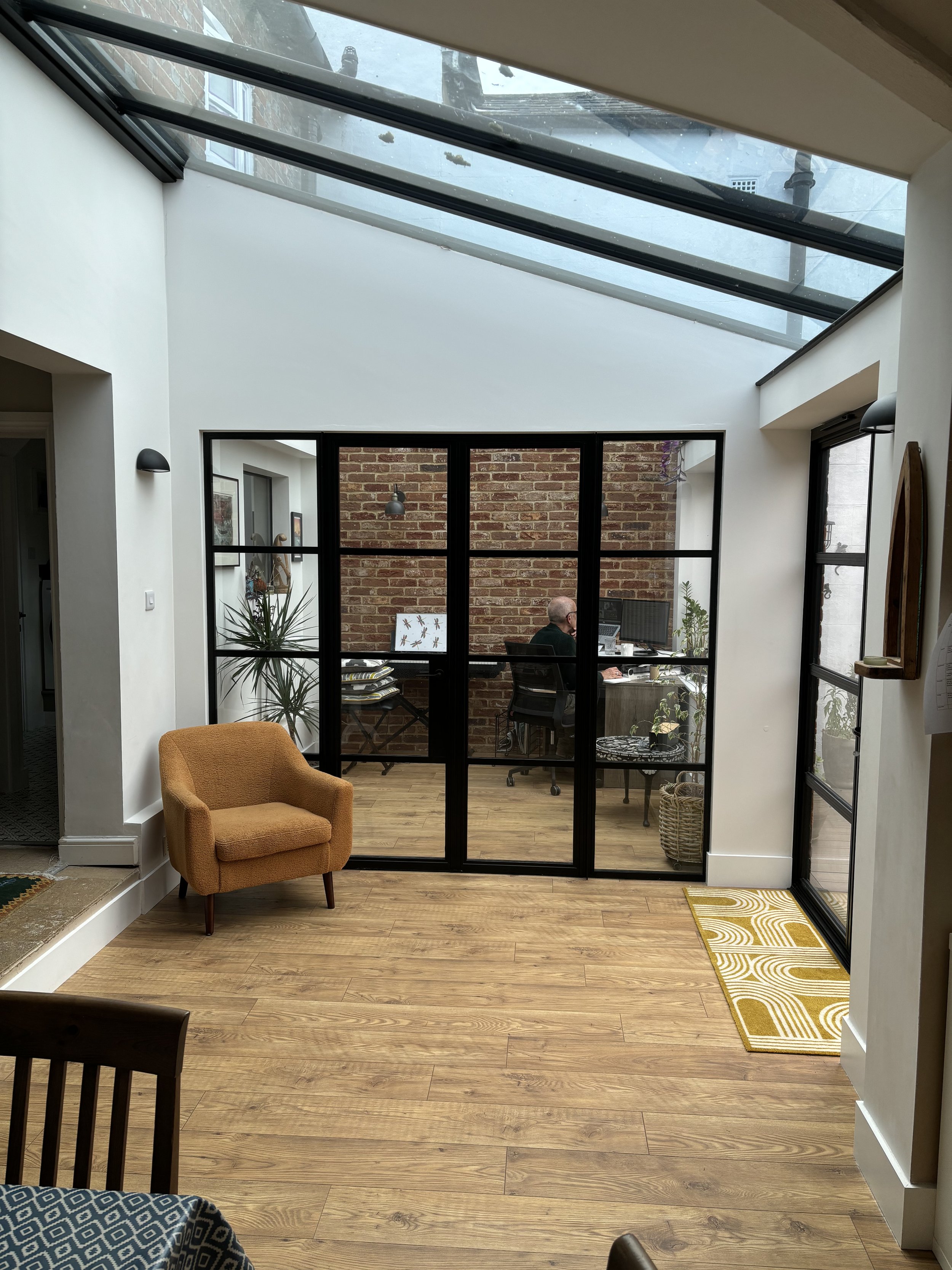 Internal glazed partition with black framework to match exterior.